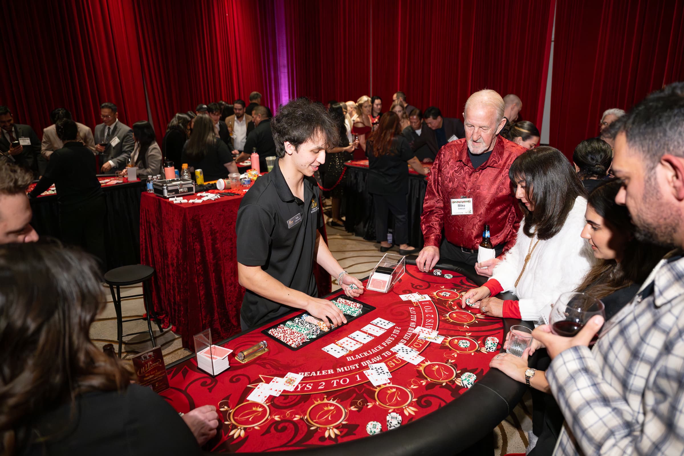 Guests playing at a gaming table during an evening event