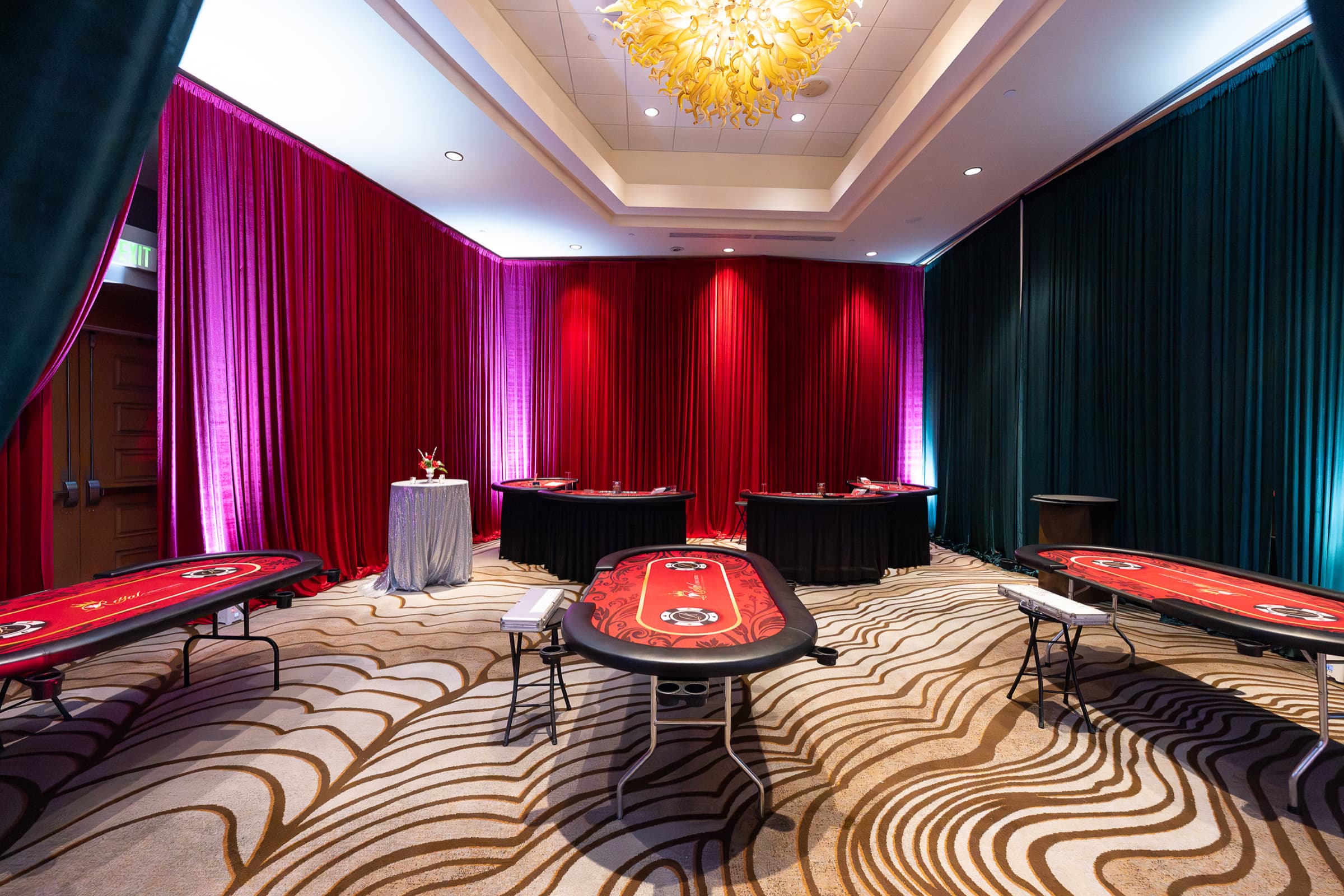Event room set with gaming tables before guests arrive