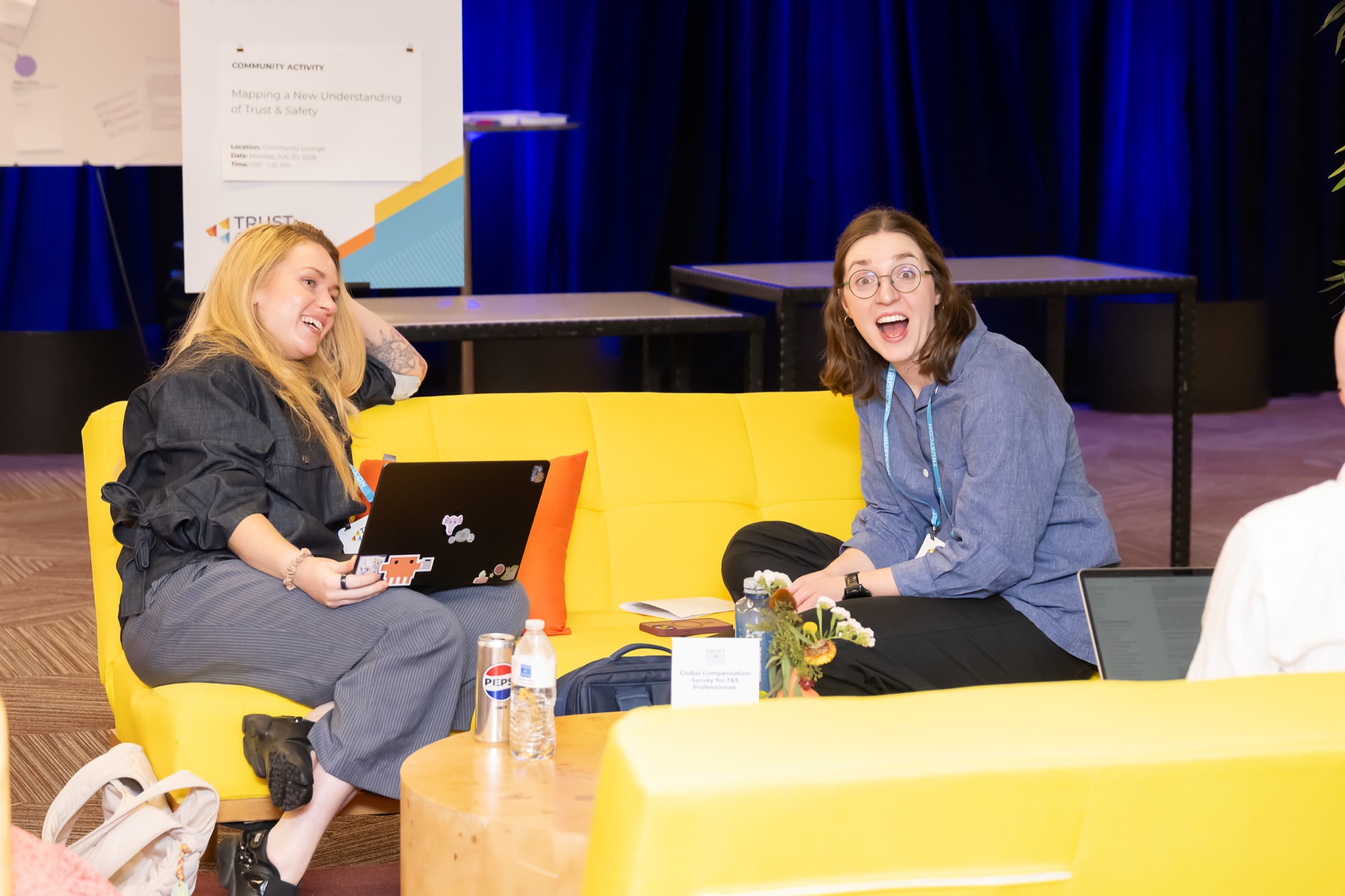 Two people seated in conversation during an informal session