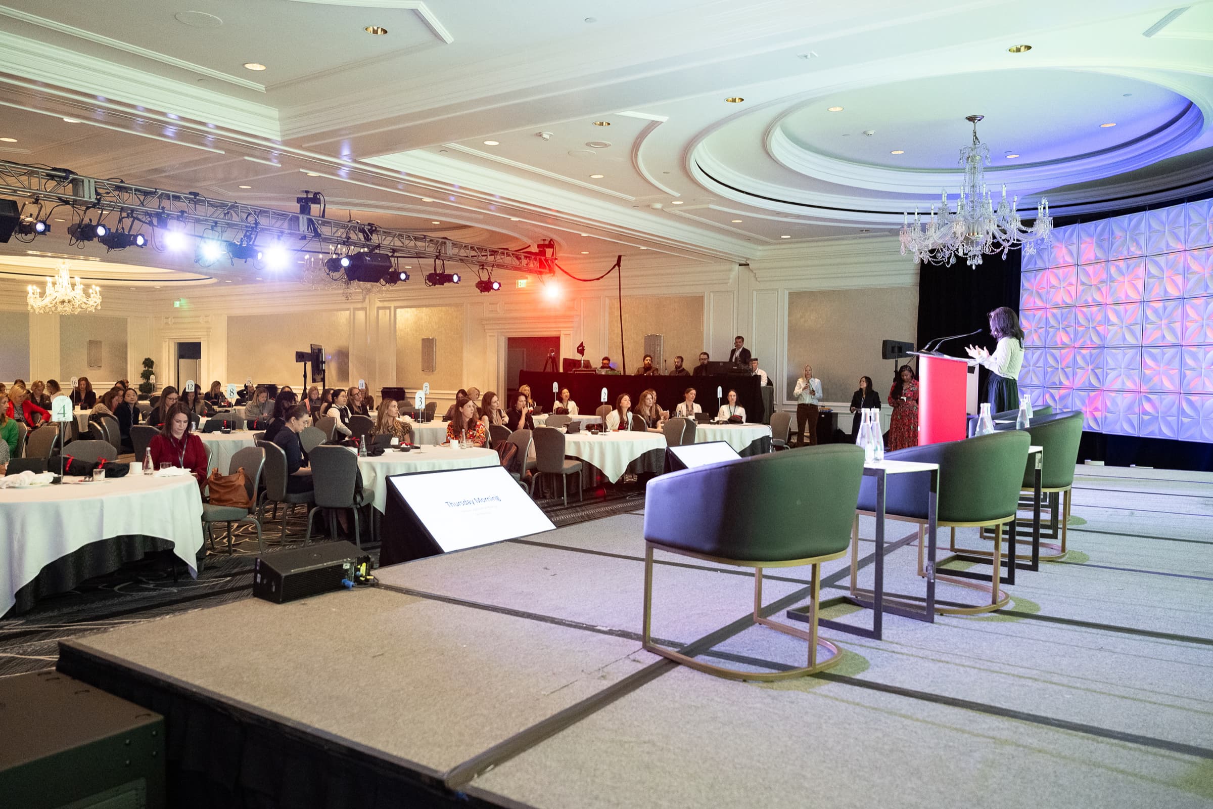 Breakout room set with round tables before a session begins