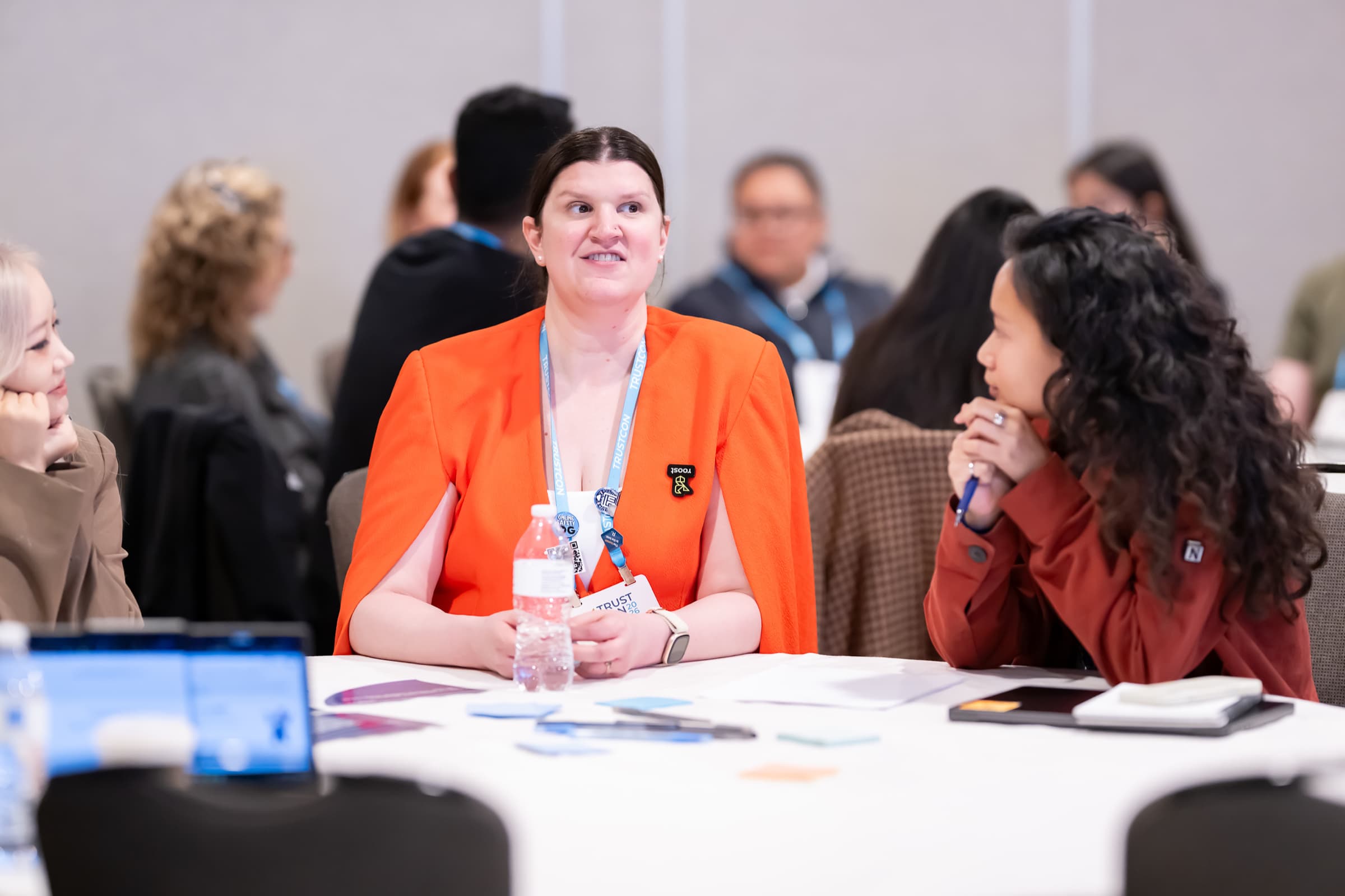 Small group in discussion around a table during a breakout