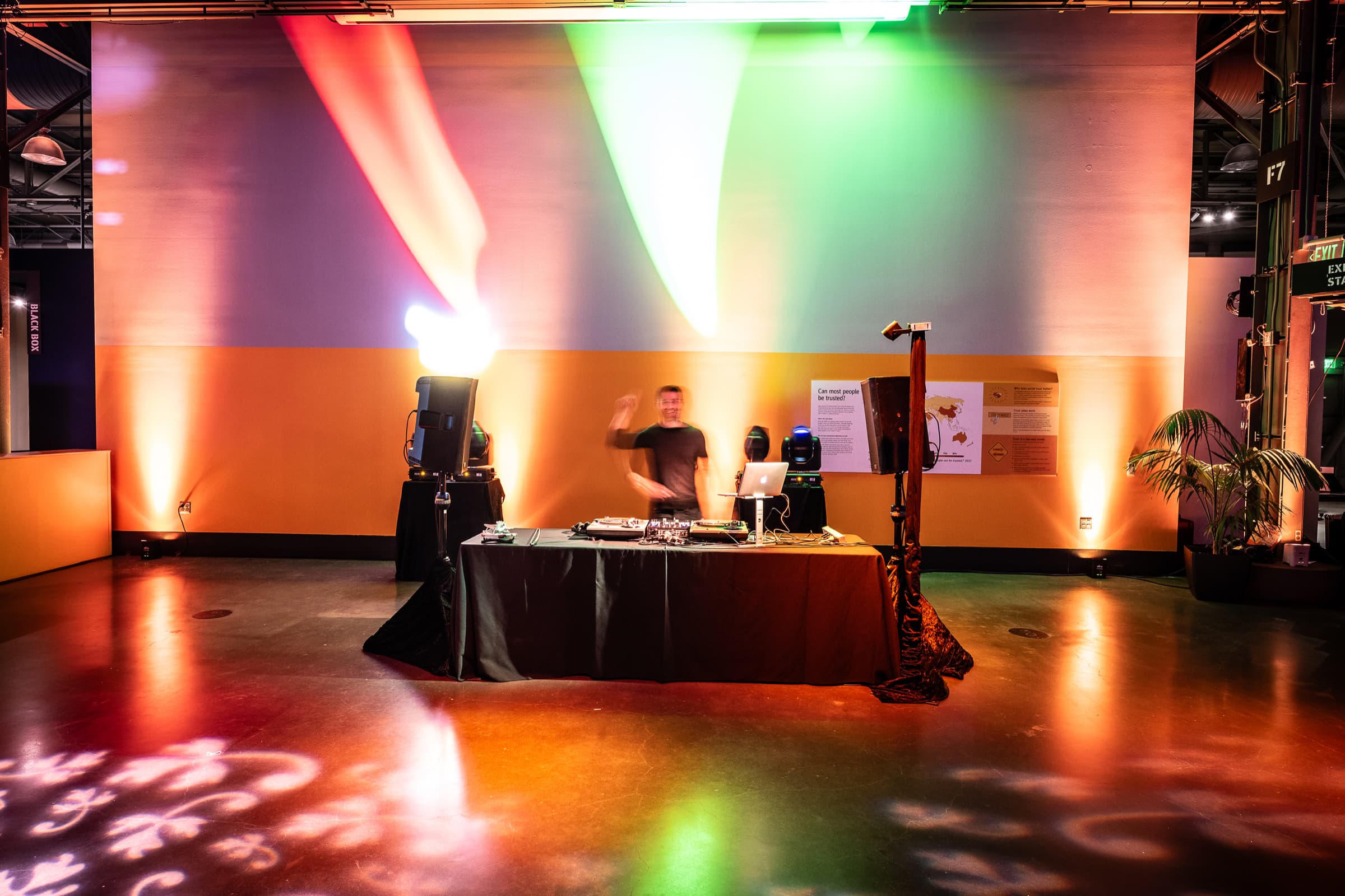 Event room under coloured uplighting before dinner guests arrive