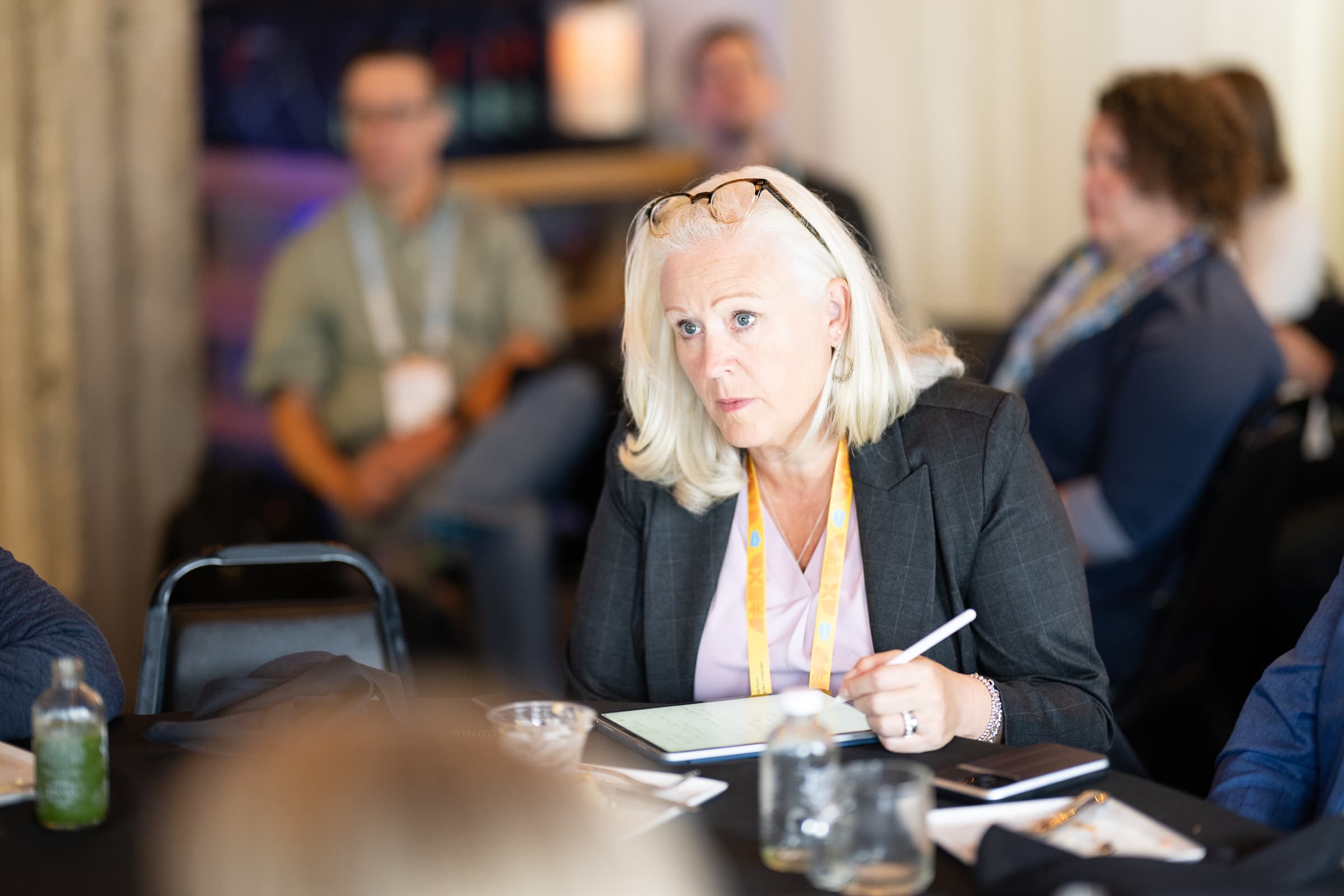 Guest taking notes during a hosted morning session