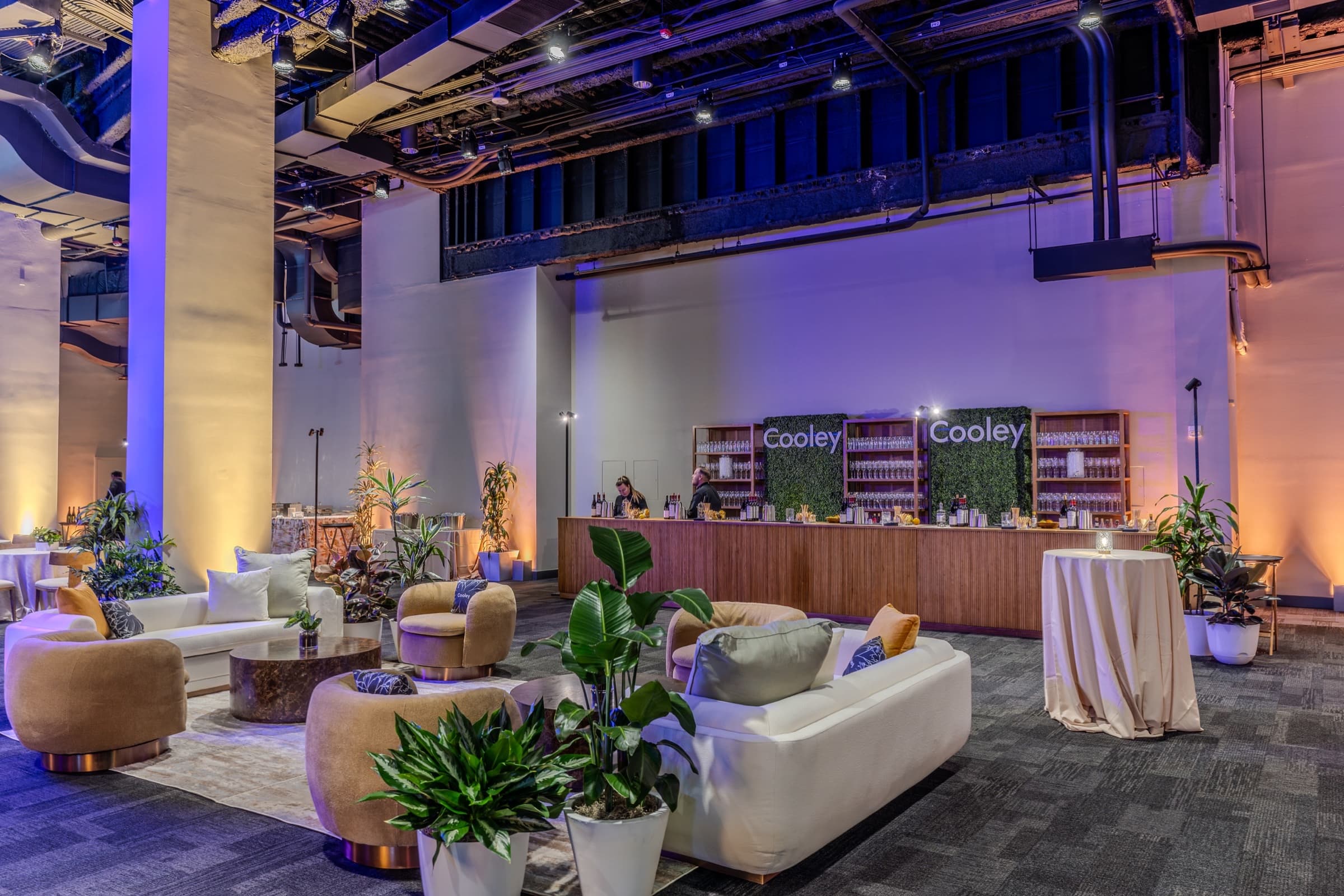 Reception lounge seating arranged and uplit before guests arrive