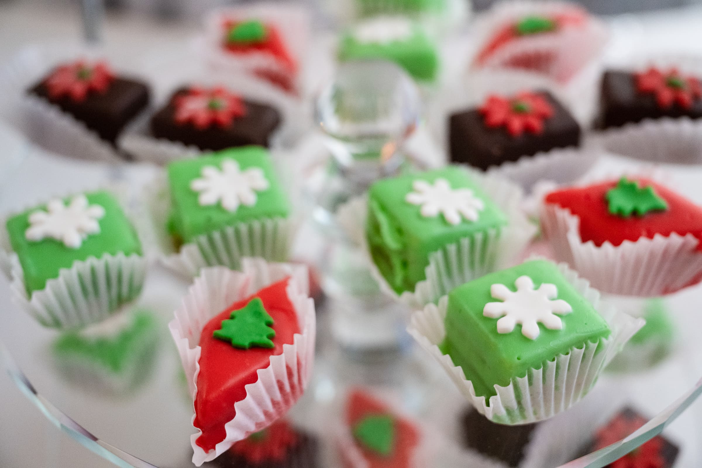 Holiday-decorated desserts arranged on a serving tray