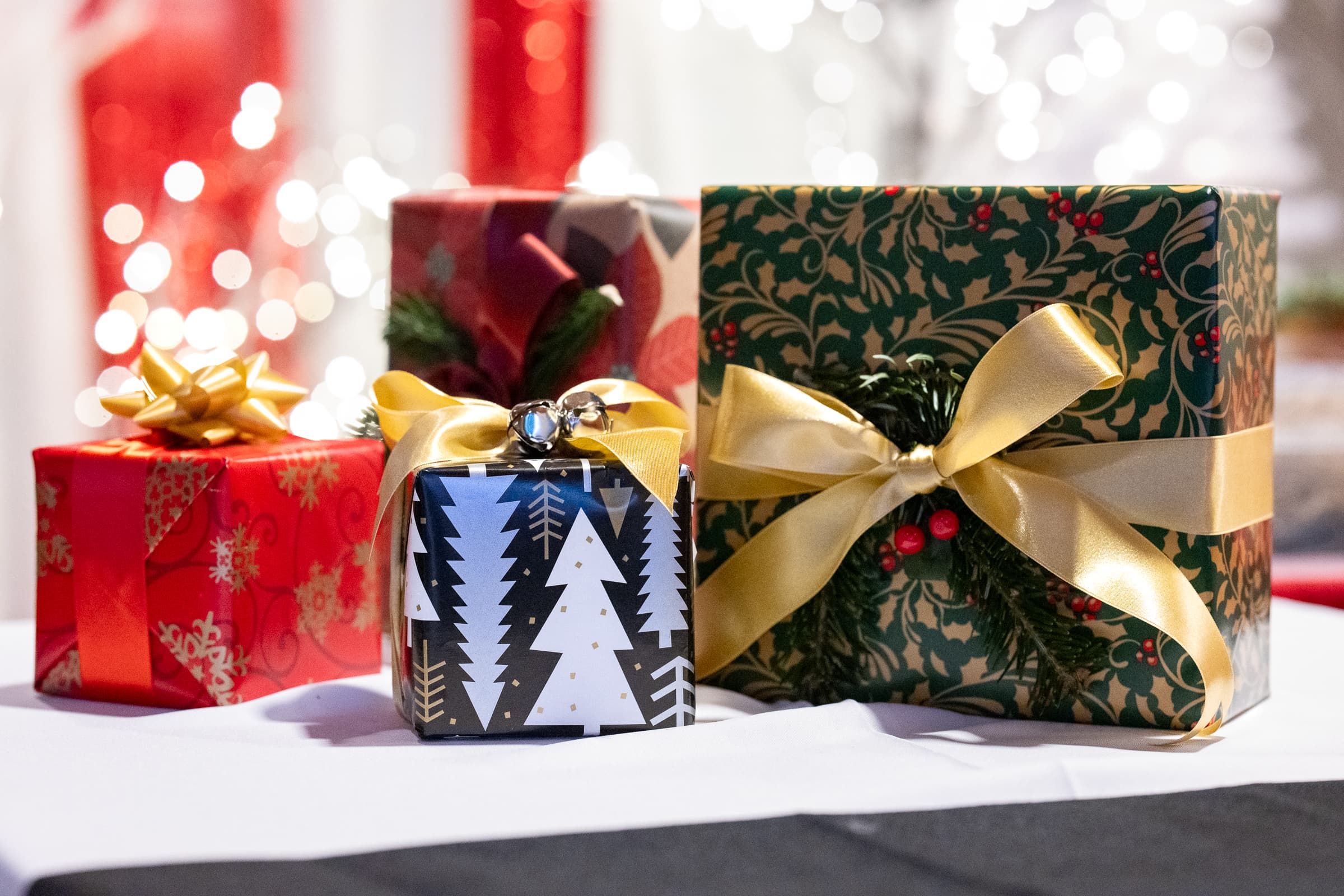 Wrapped holiday gifts arranged as part of the party decor