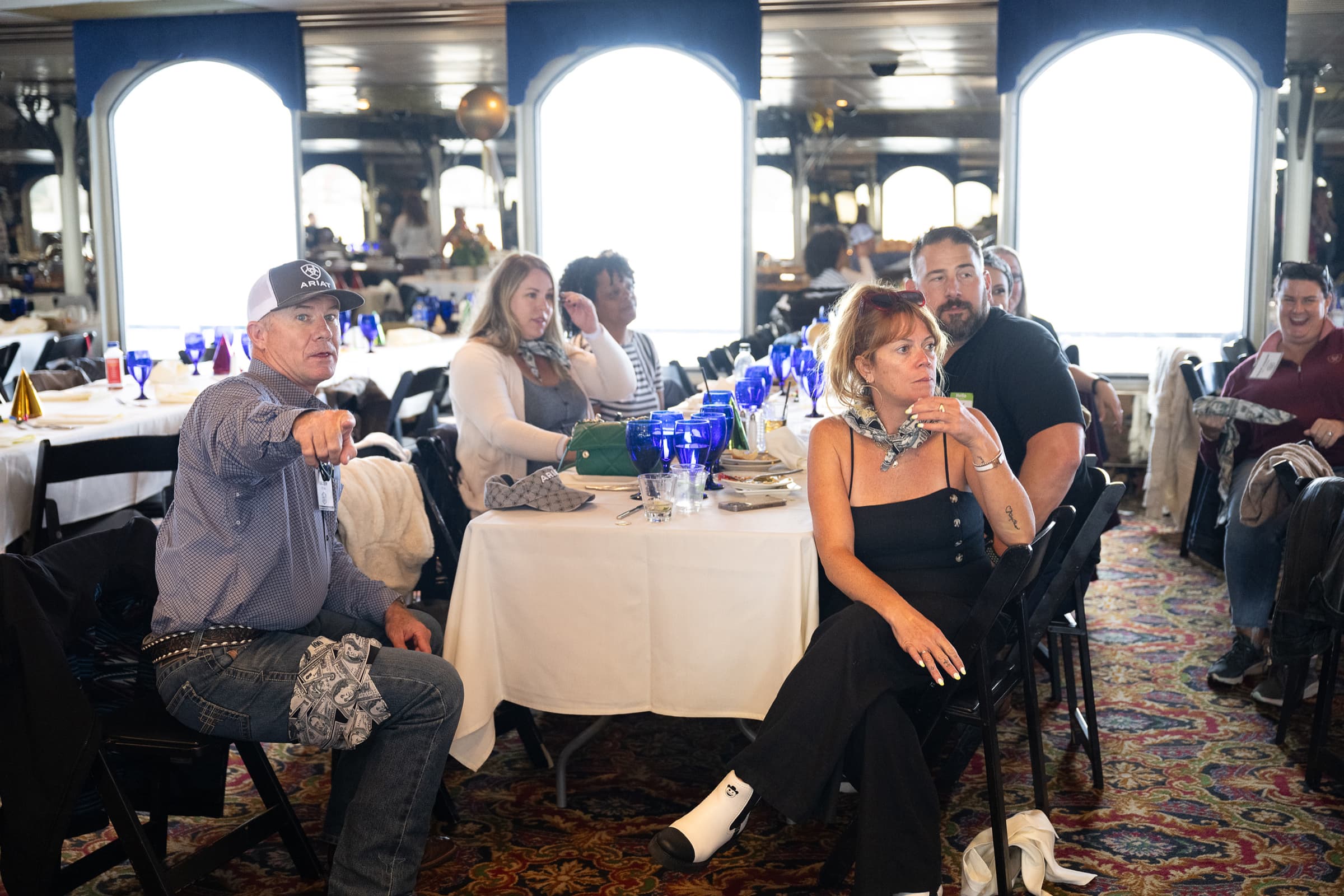 Guests seated at tables during a daytime charter event
