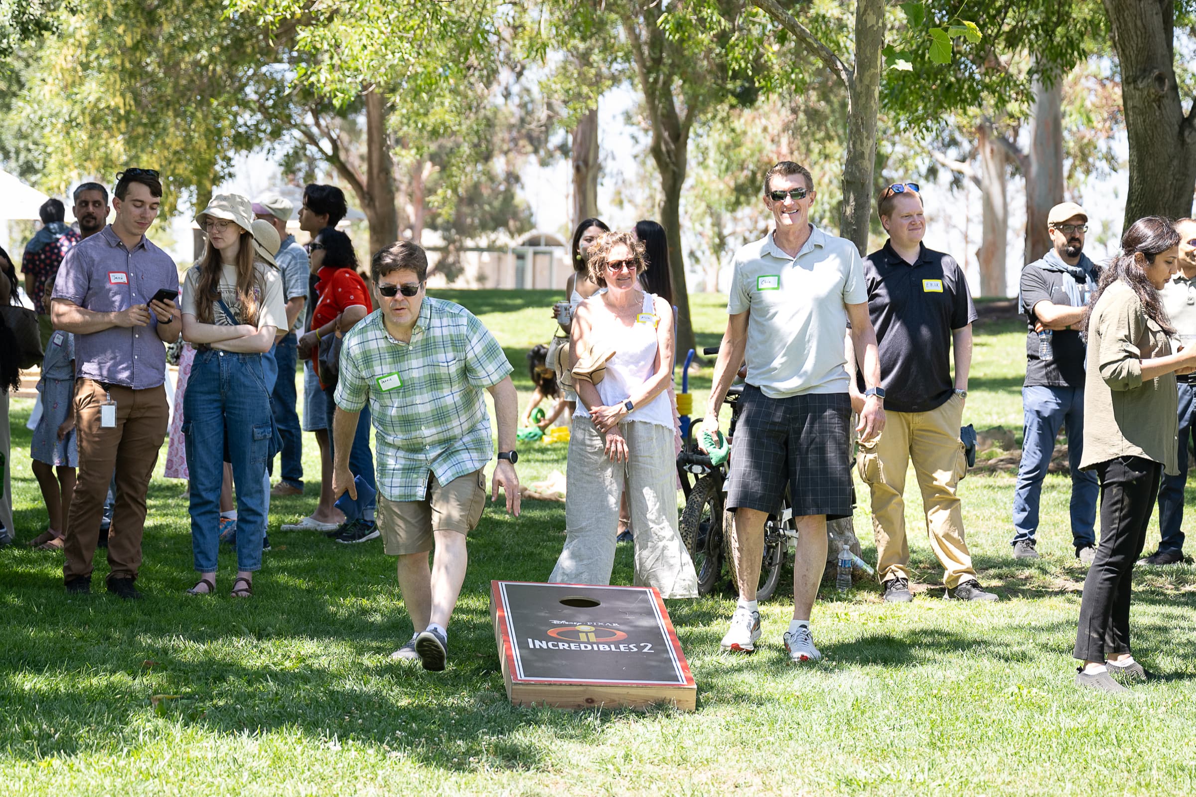 Colleagues playing lawn games at an outdoor company event