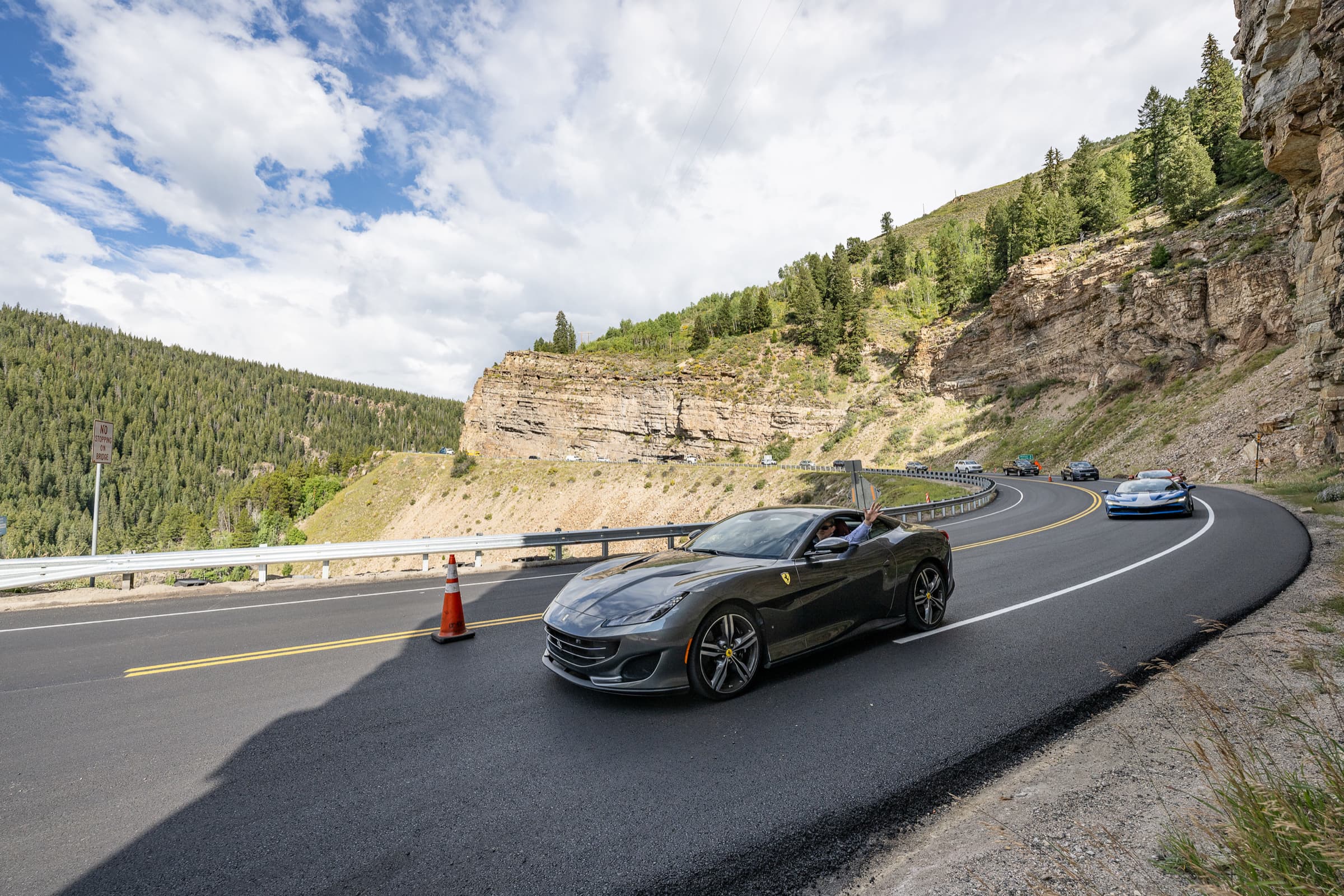 A sports car on a mountain highway during a driving event