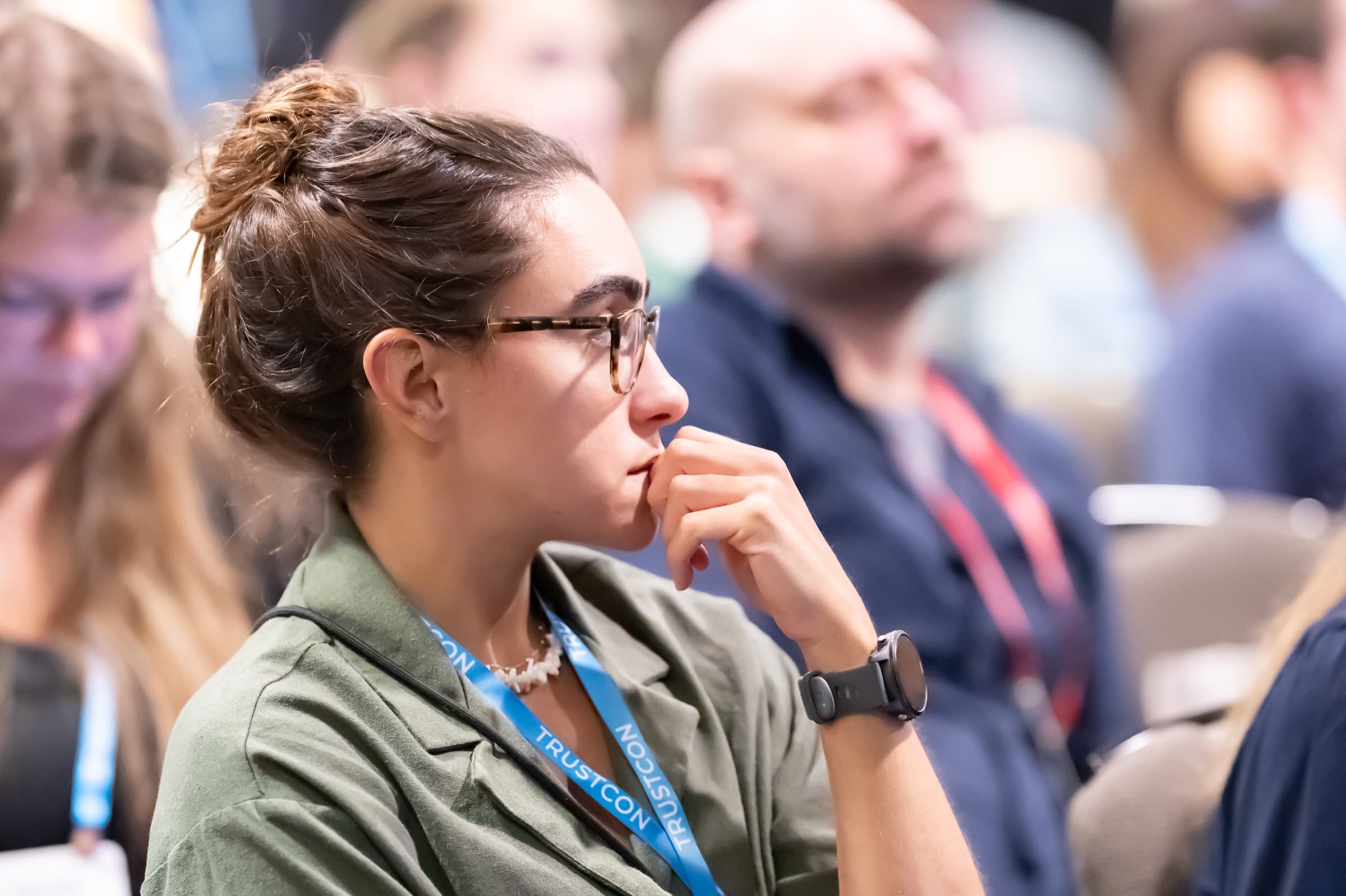 Close candid of an attendee listening during a session