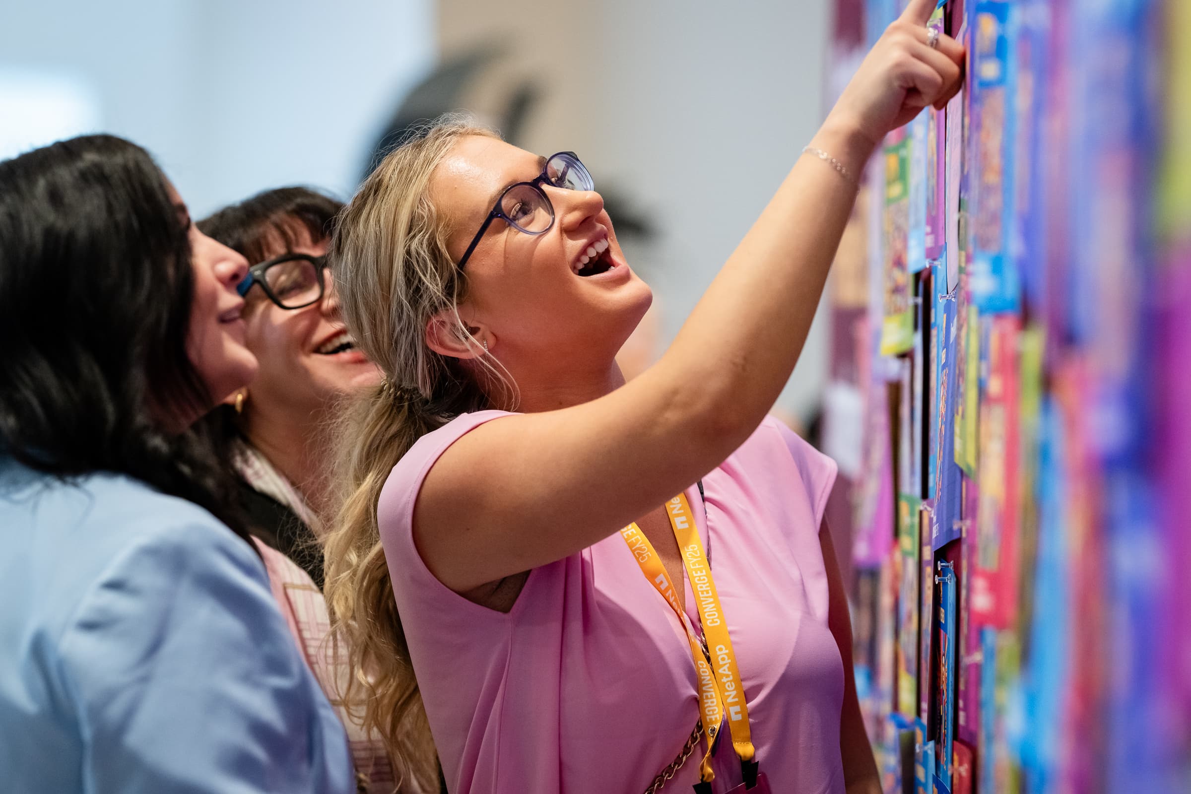Attendees interacting with a colorful digital installation