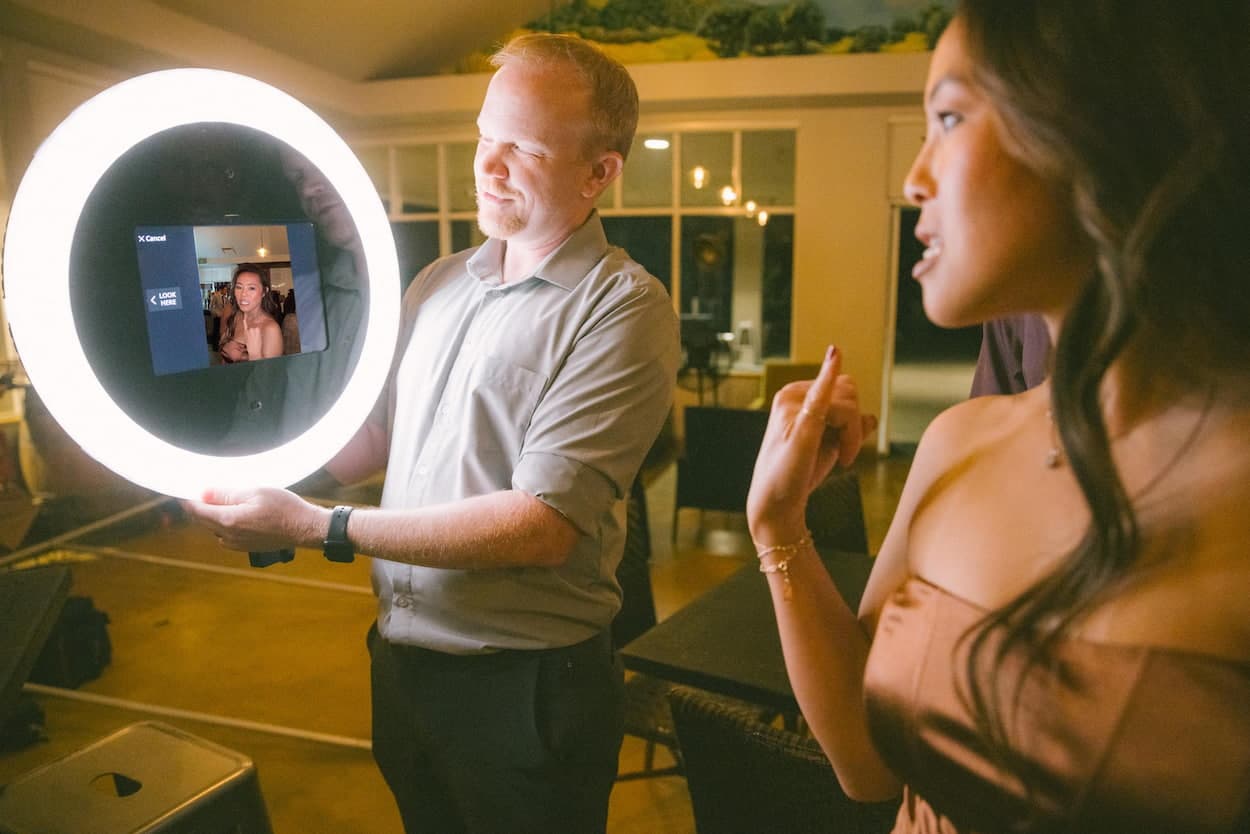 Roaming photo station capturing candid event photos with instant sharing