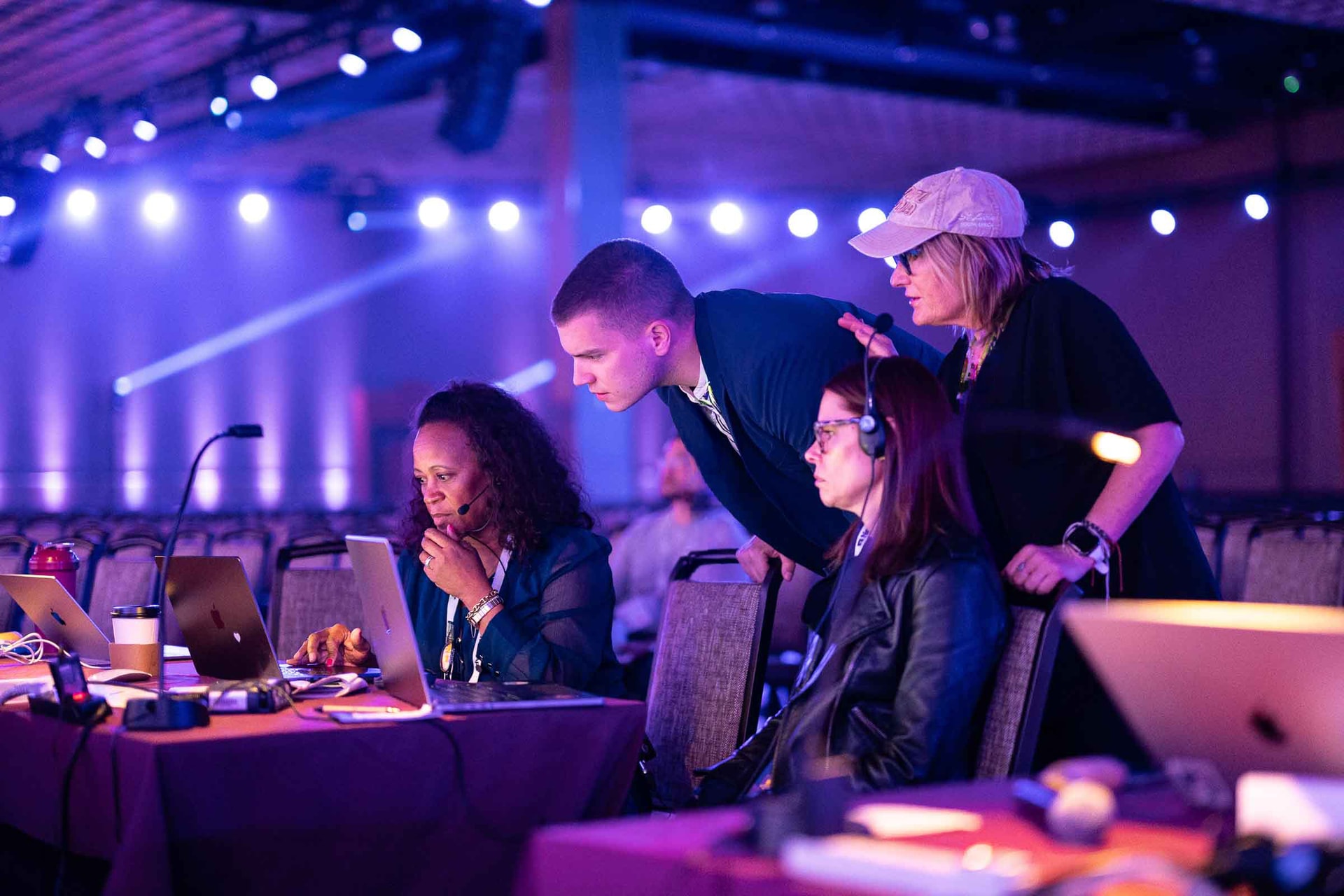 Joëlle C. Duffy, independent content producer, at her desk during an event.