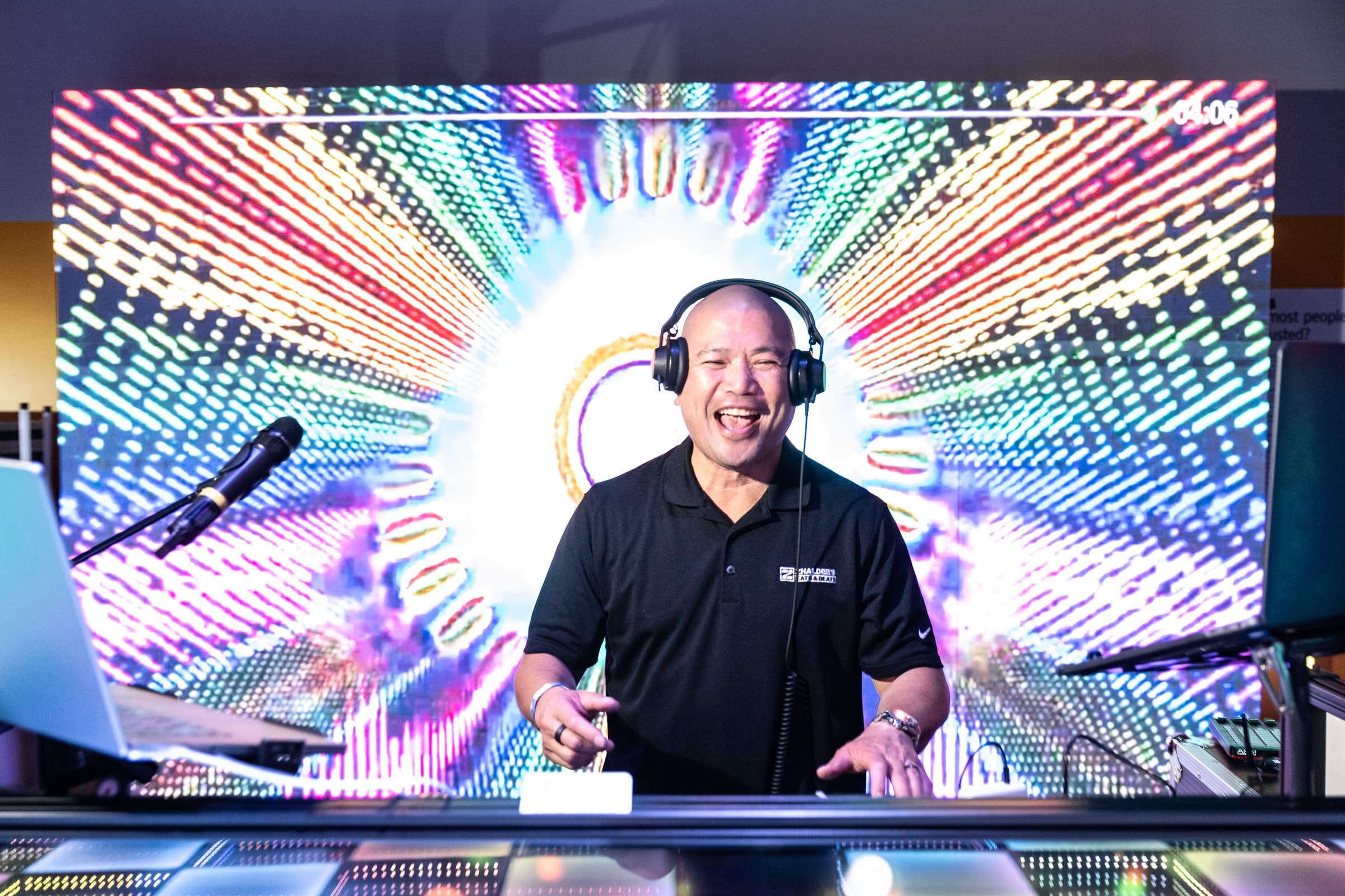 DJ performing inside an LED tunnel of concentric light