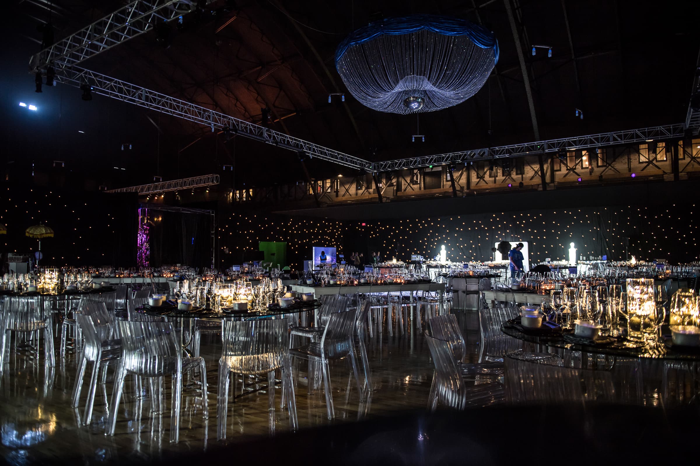 Ballroom set for dinner photographed from above beneath a domed ceiling