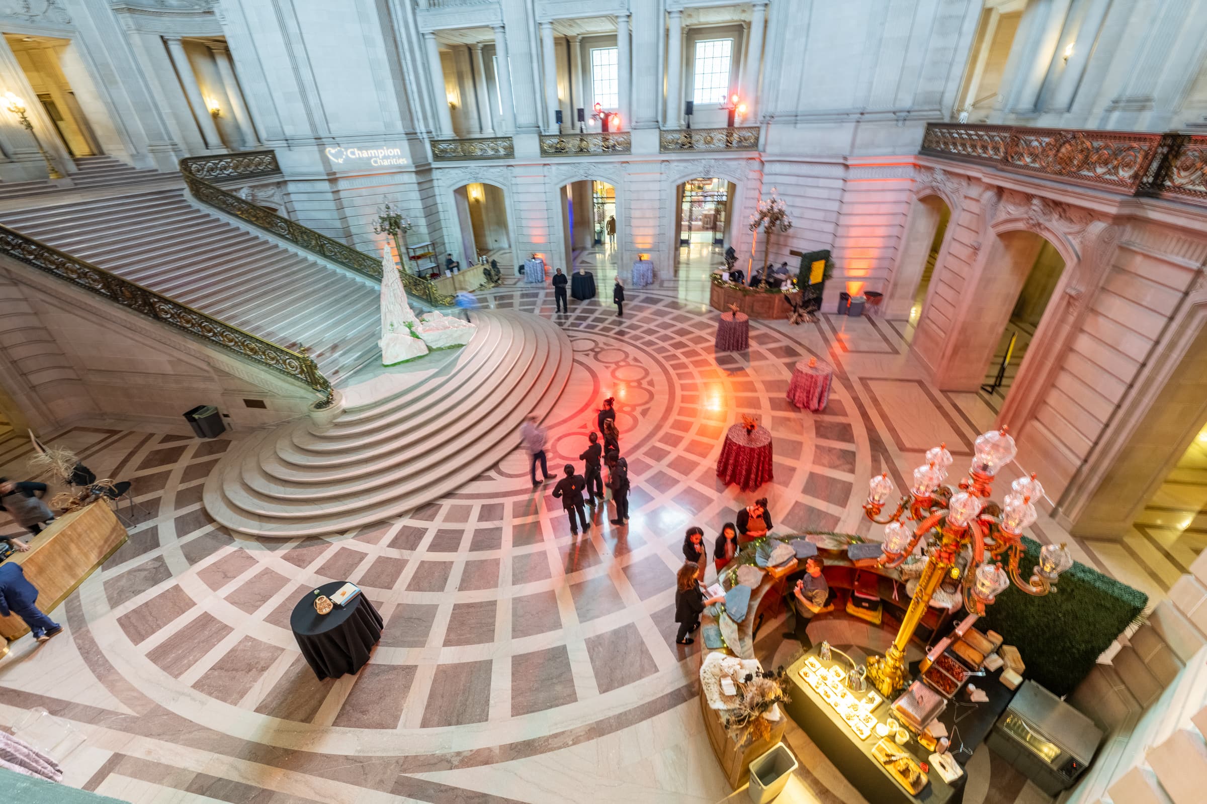 Grand civic rotunda set for an evening reception, seen from the balcony