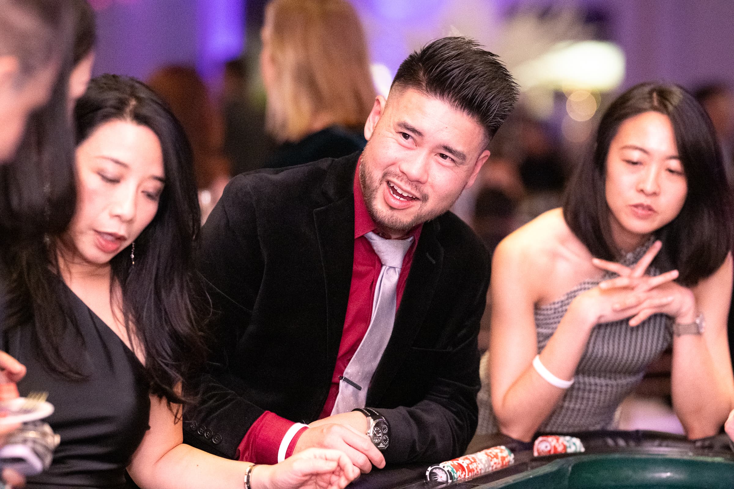 Guests actively engaged in casino gaming at corporate event