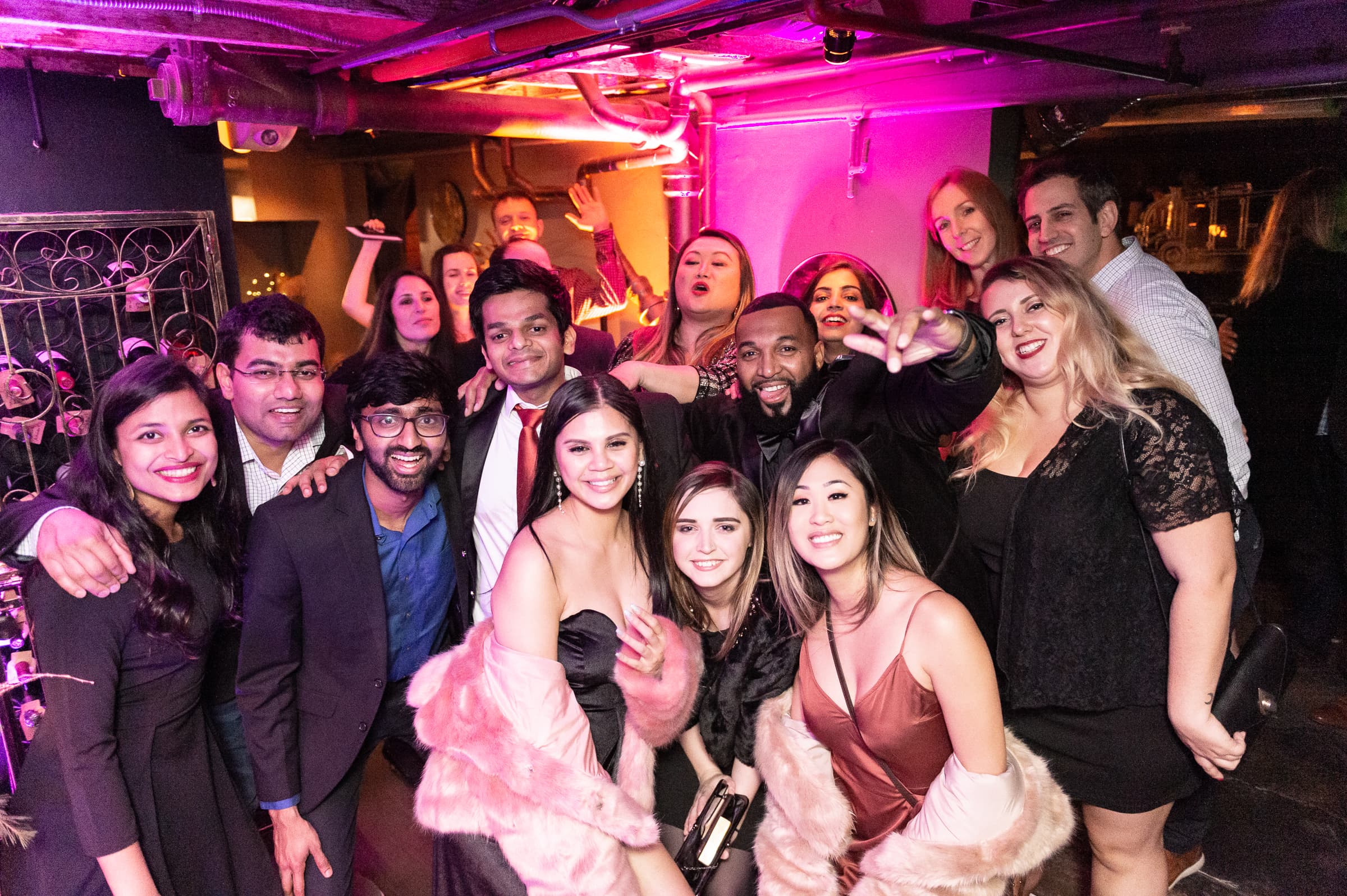 Large group of guests celebrating together on the dance floor