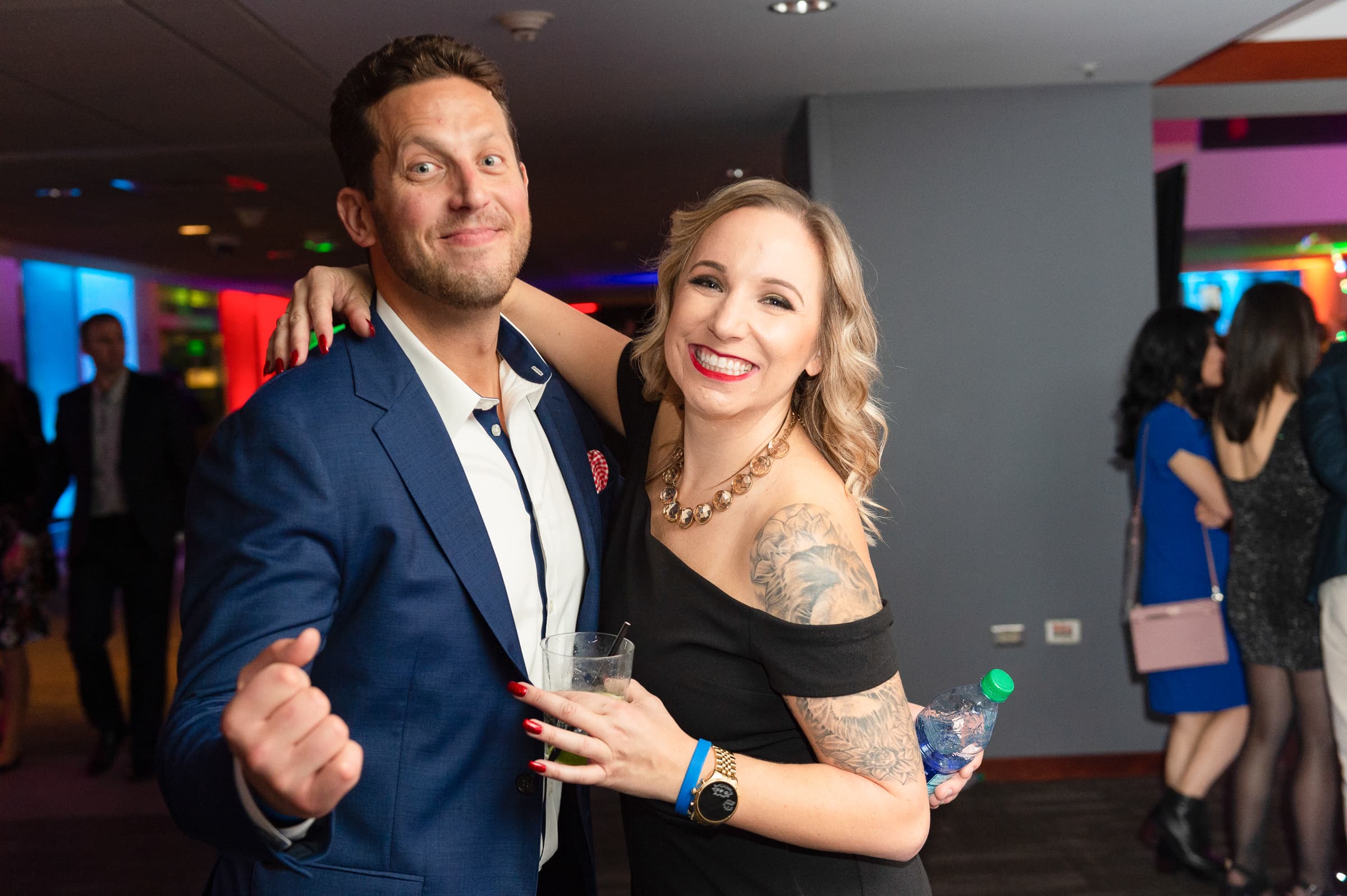 Two guests posing together on the party floor