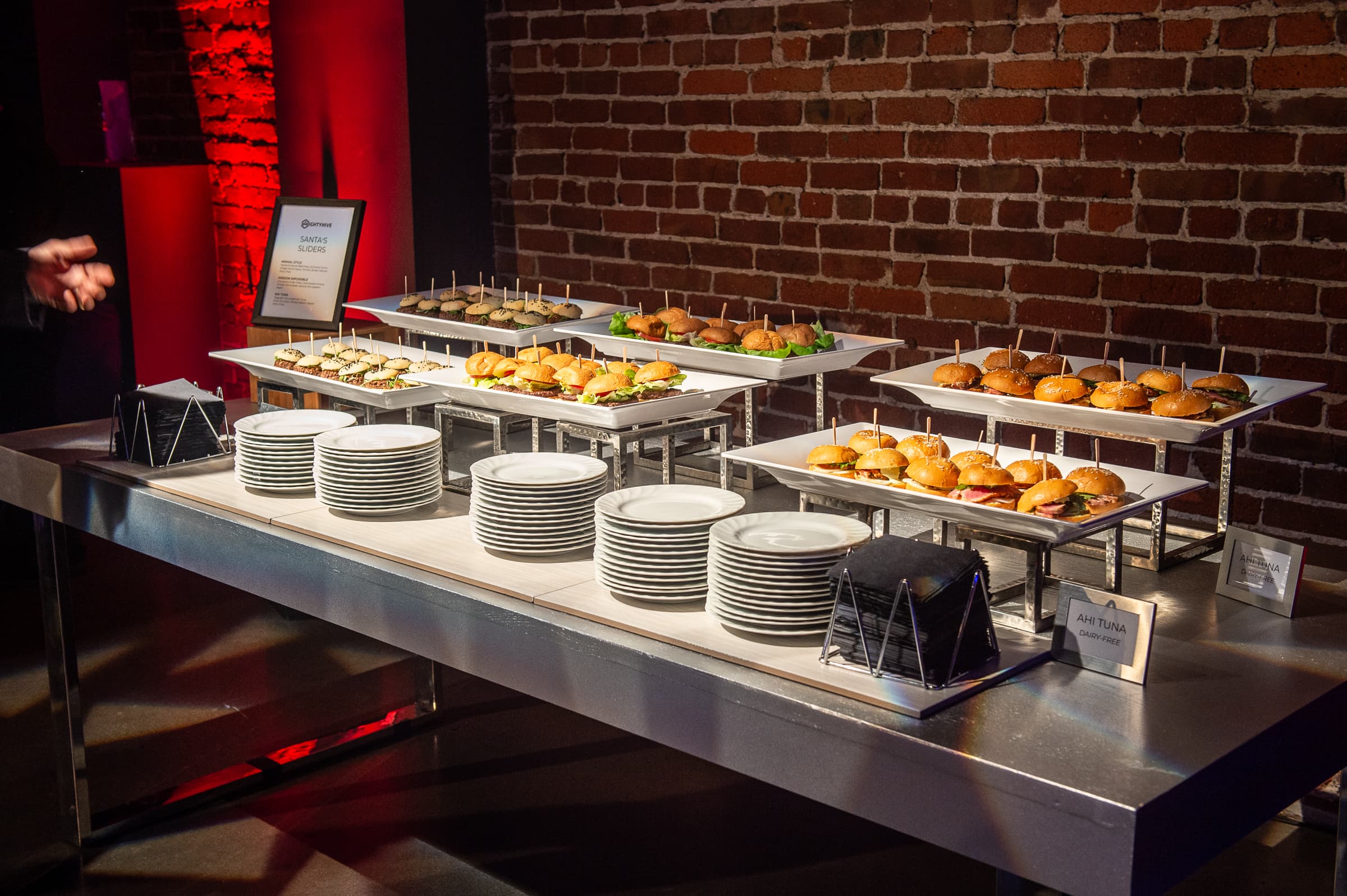 Catering buffet laid with stacked plates before service