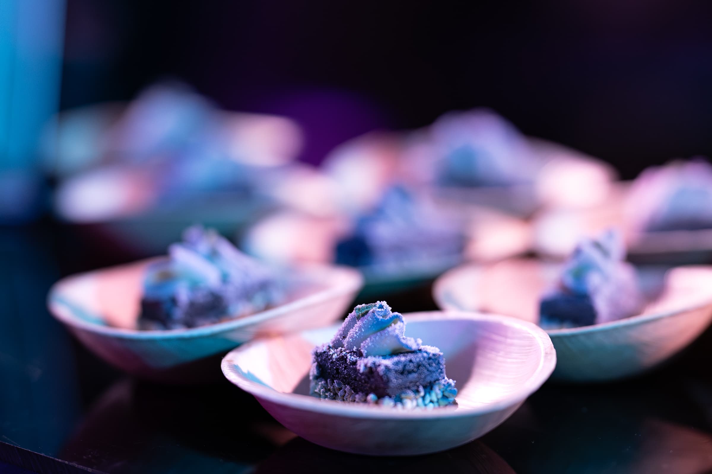 Close view of individual desserts plated in small bowls