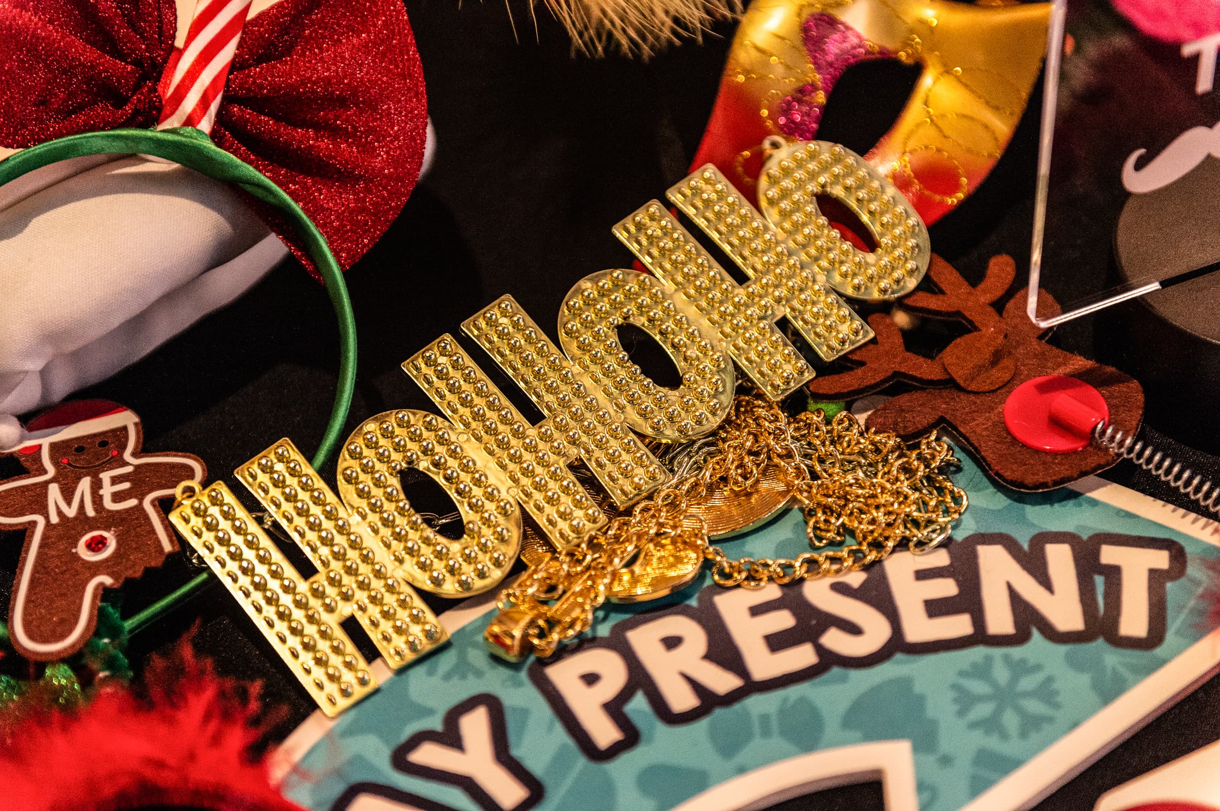 Close view of glittered holiday photo props arranged on a table