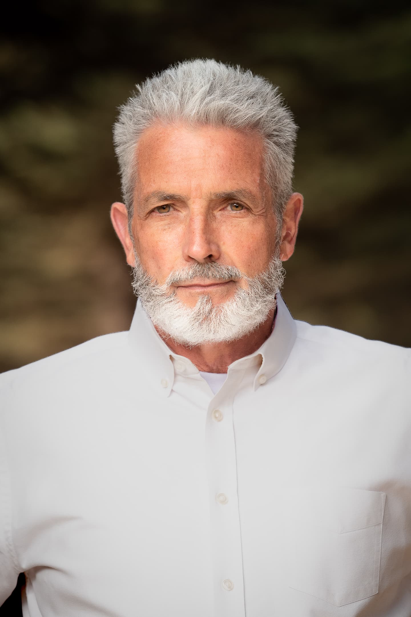 Senior executive portrait in outdoor setting