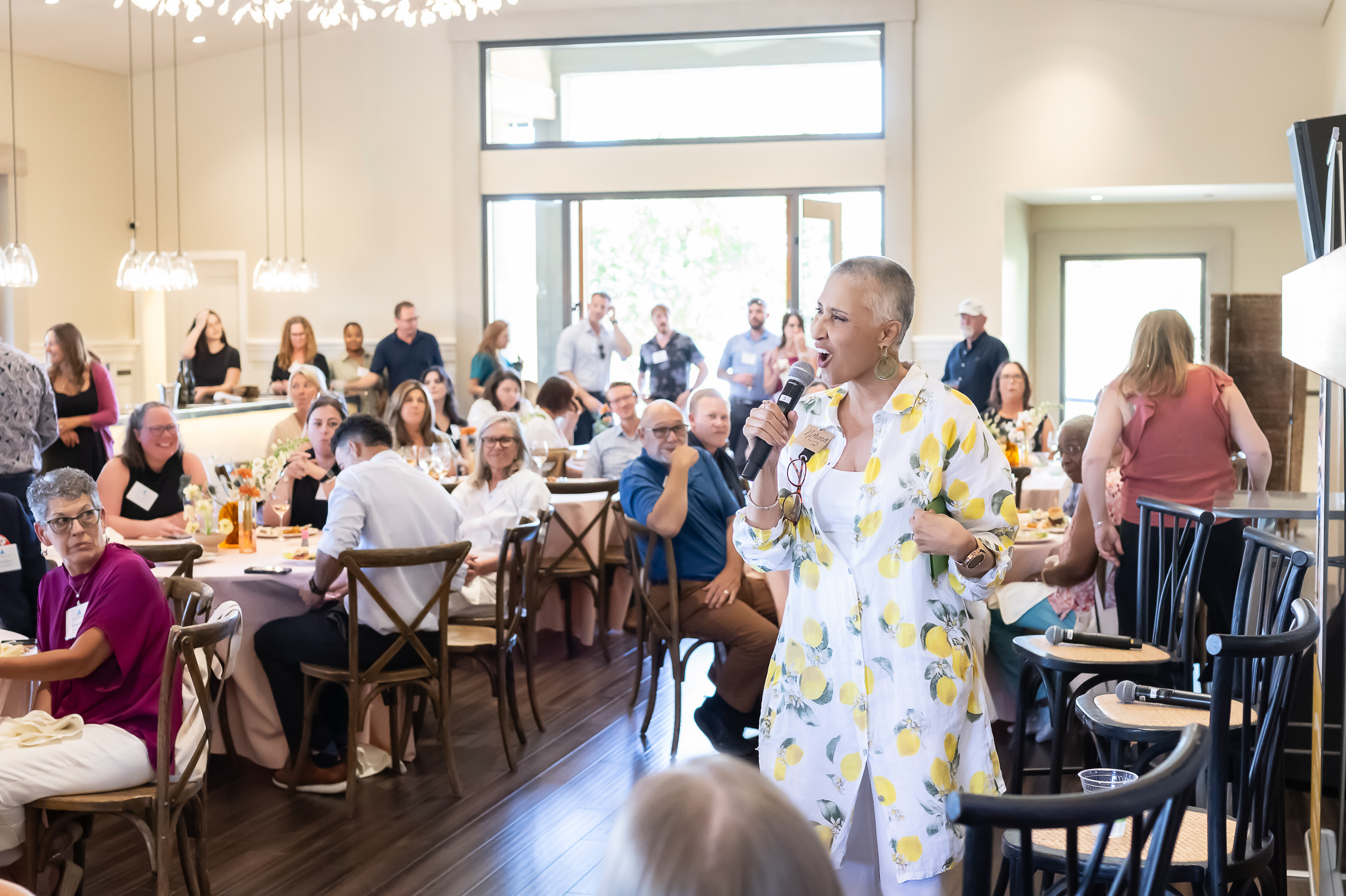 Speaker welcoming attendees at All Things Meetings Wine Country at Paradise Ridge Winery
