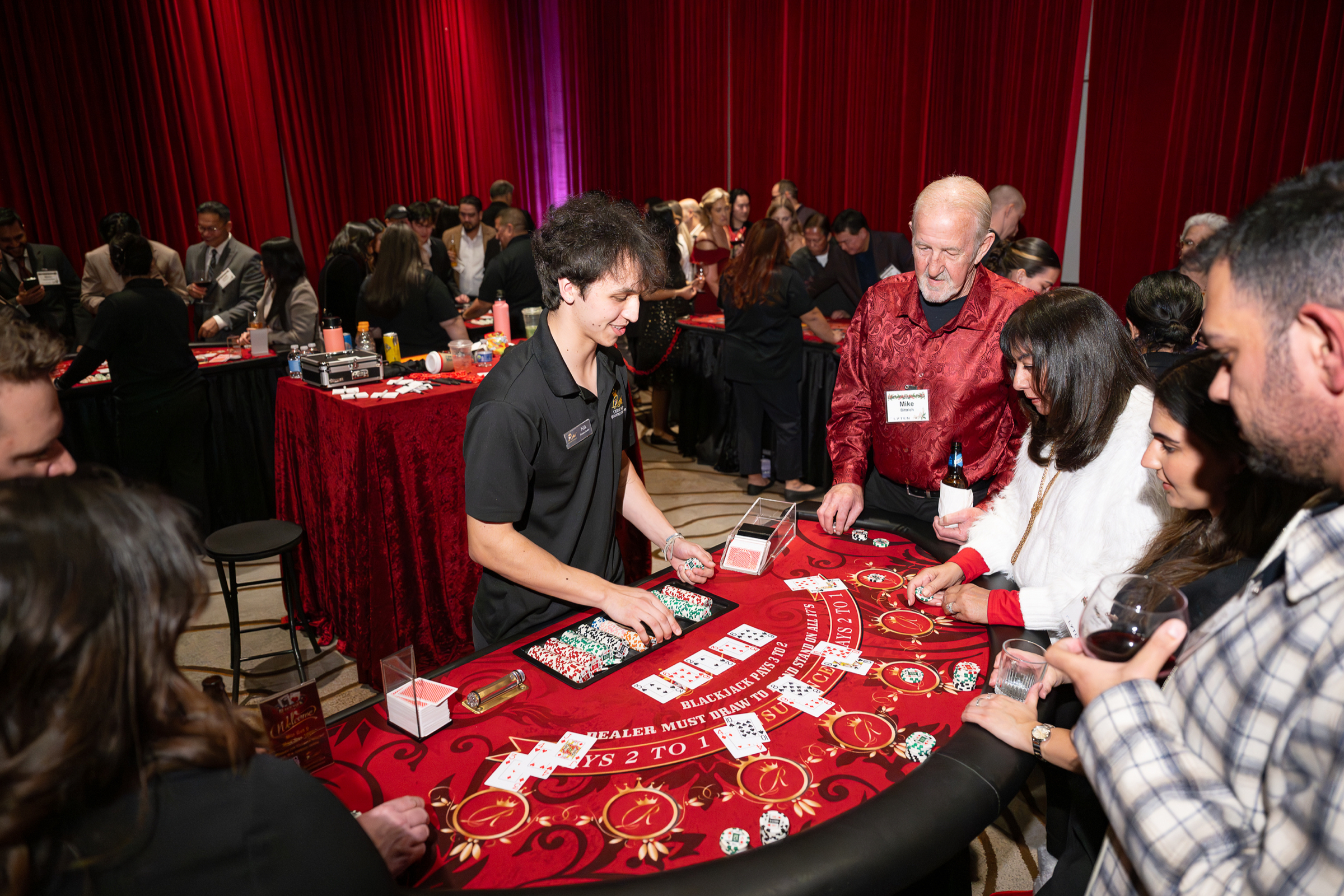 Guests playing at a gaming table during an evening event