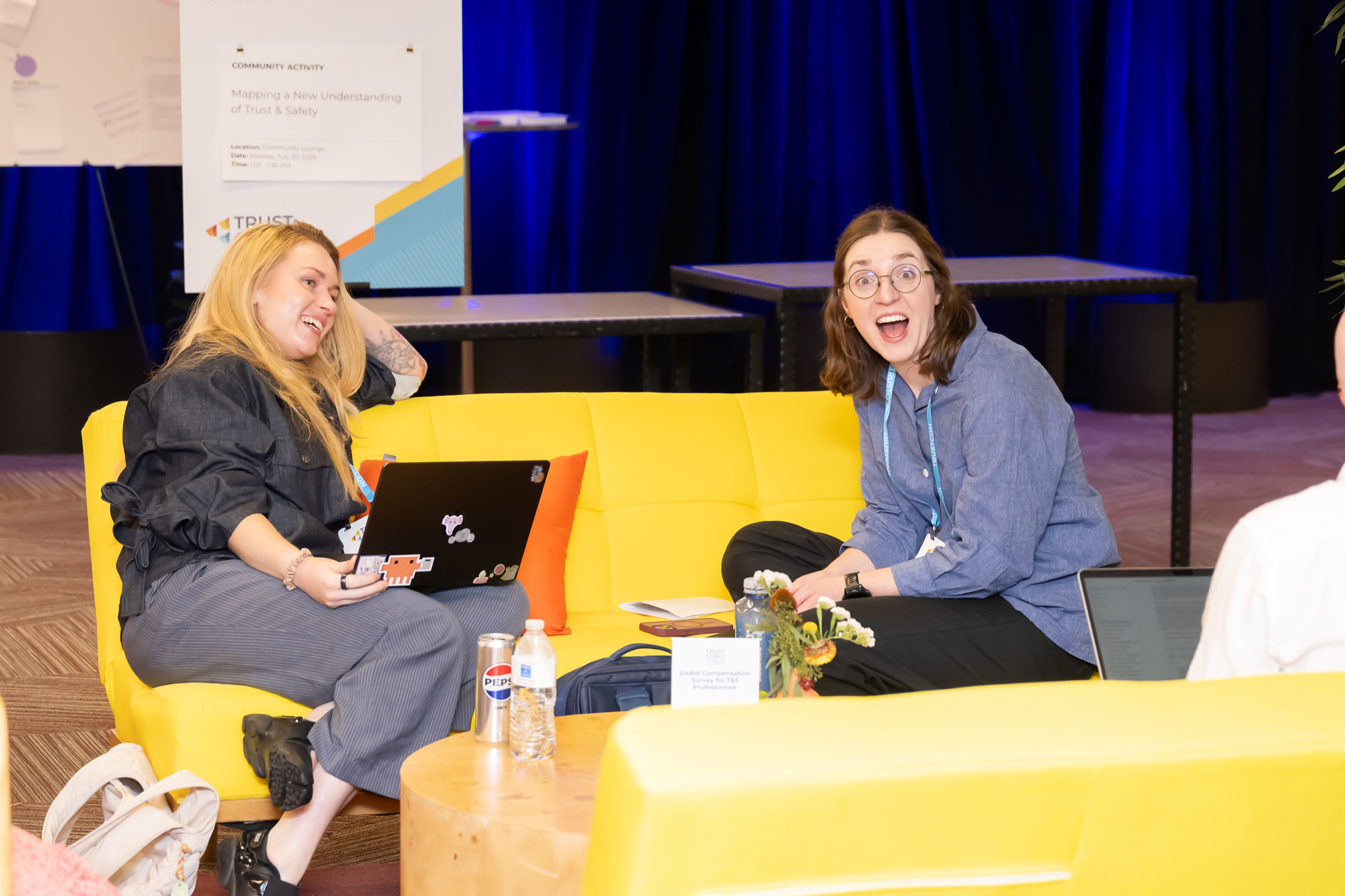 Two people seated in conversation during an informal session
