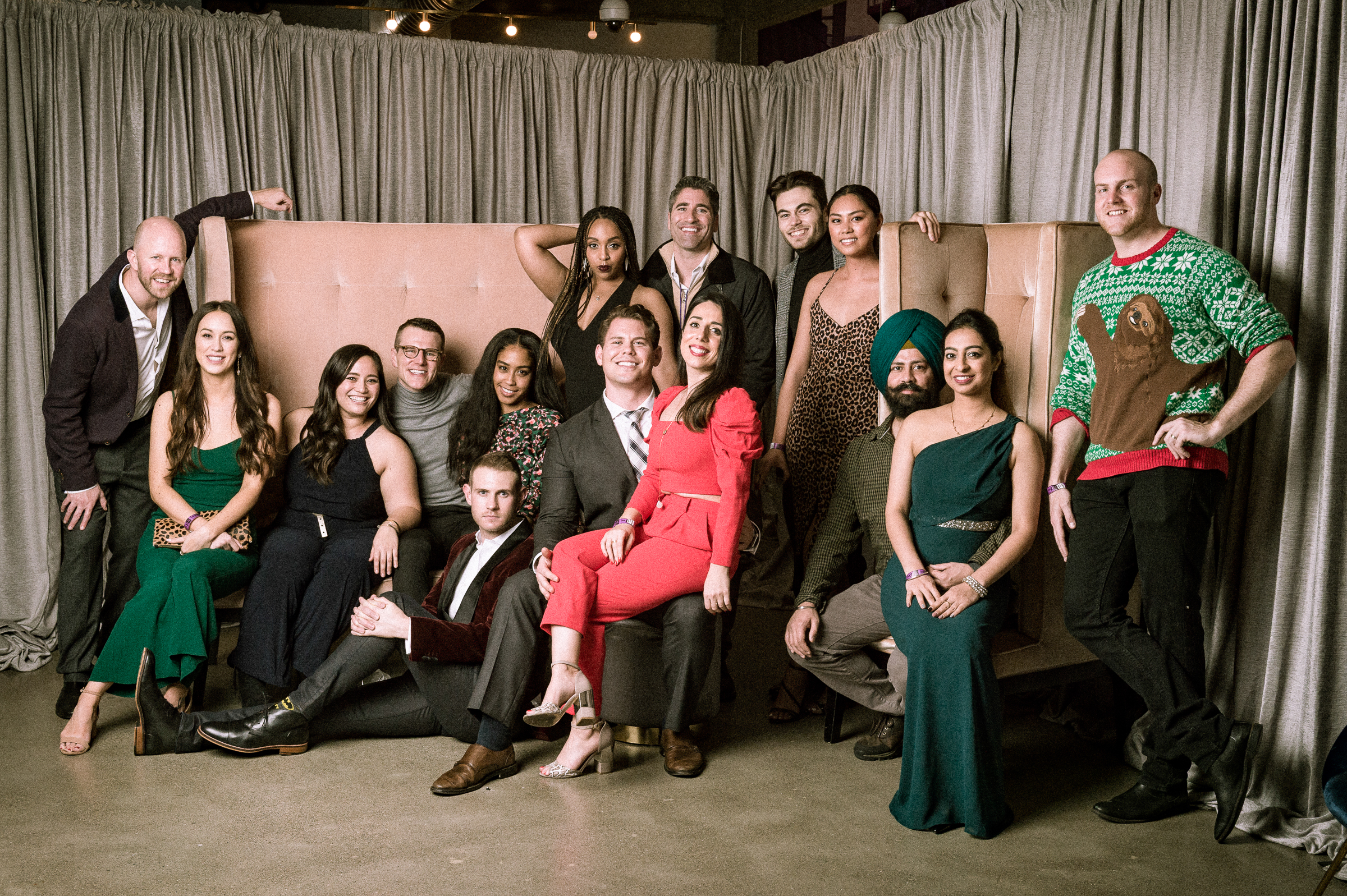 Colleagues gathered for a group photo at a corporate holiday party