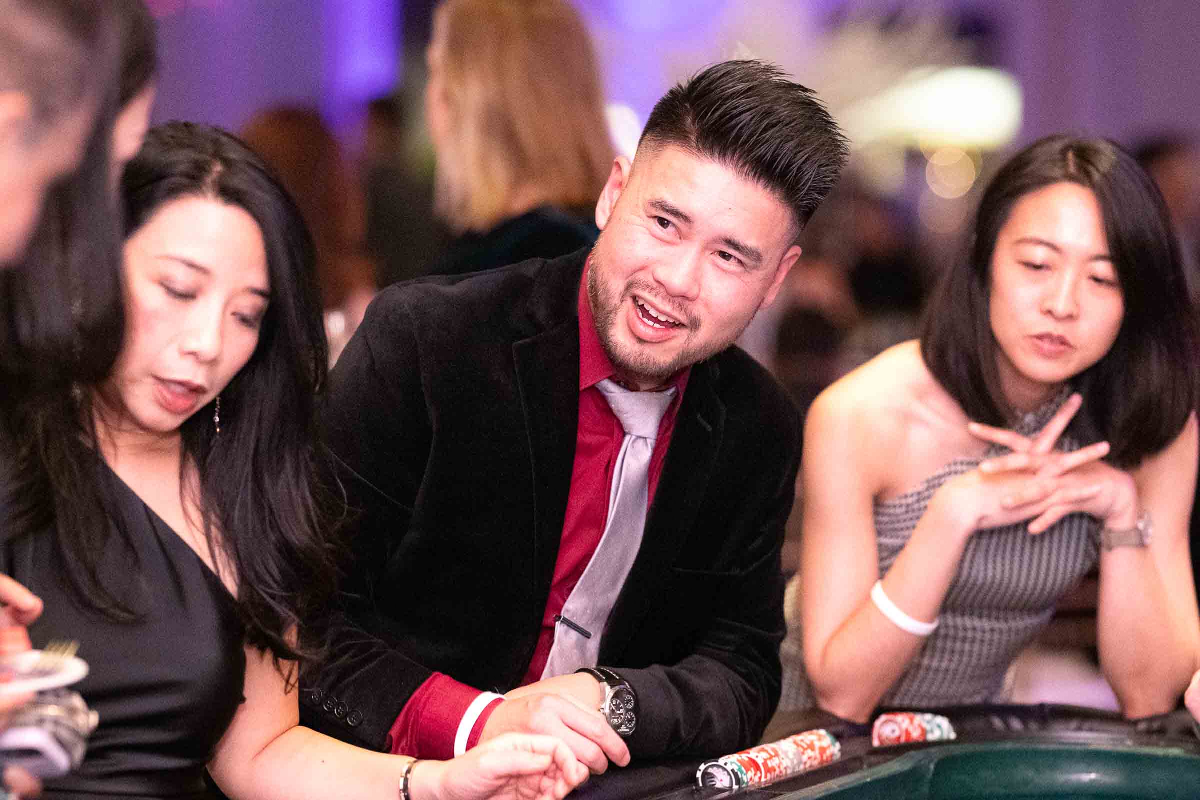Guests actively engaged in casino gaming at corporate event