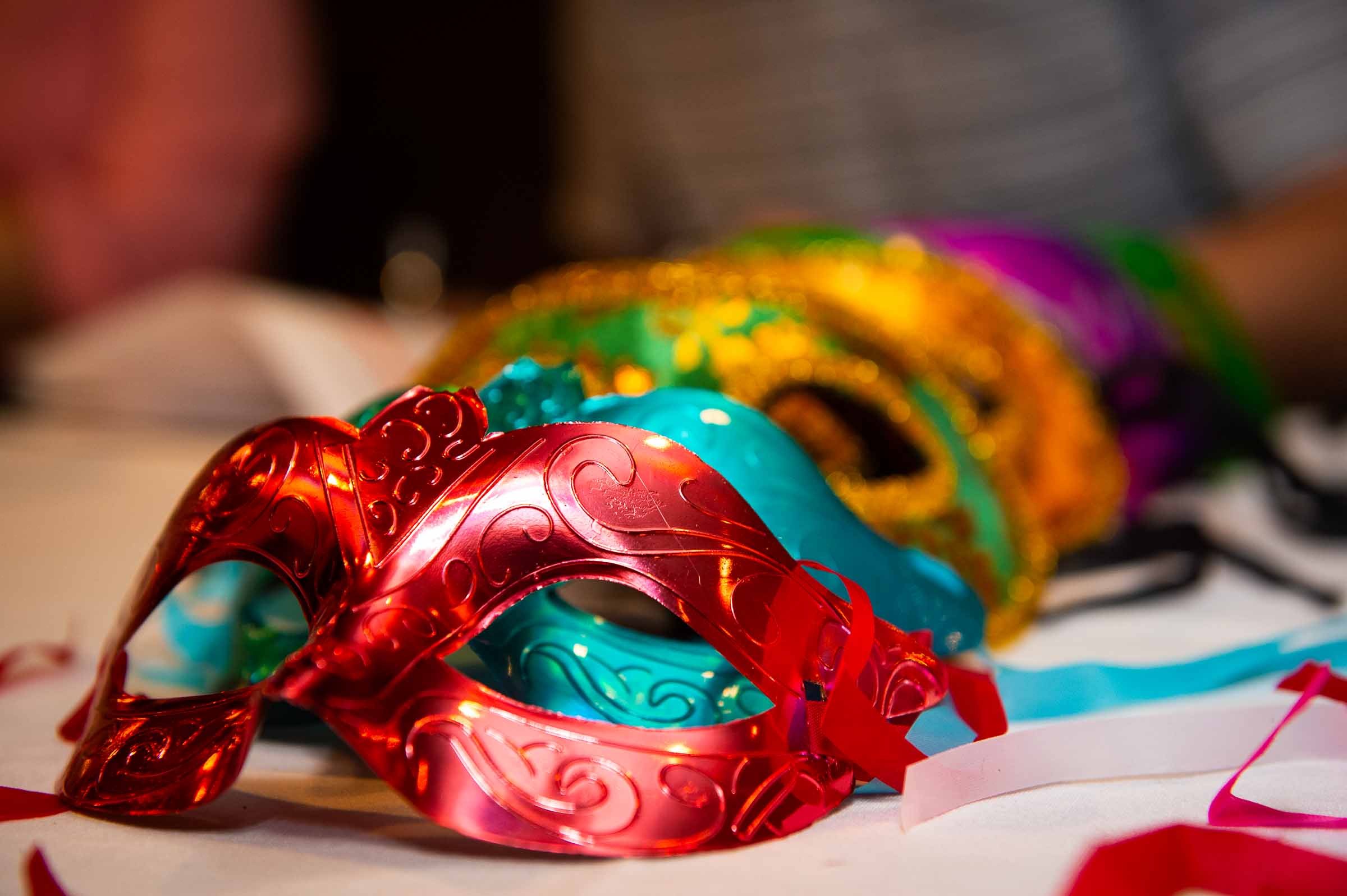 Detail shot of ornate masquerade mask at themed gala event