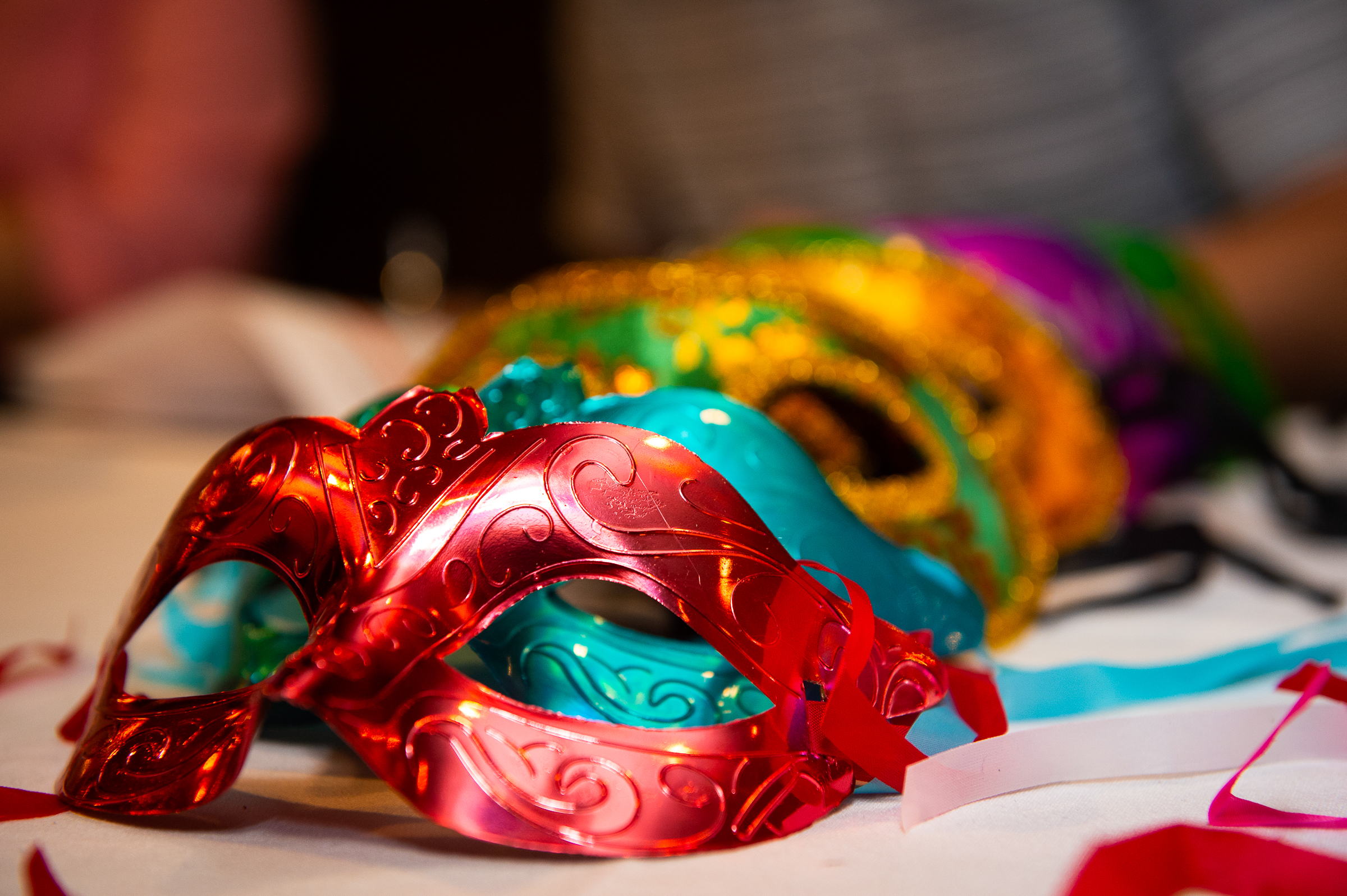 Detail photograph of a decorative masquerade mask at a themed gala