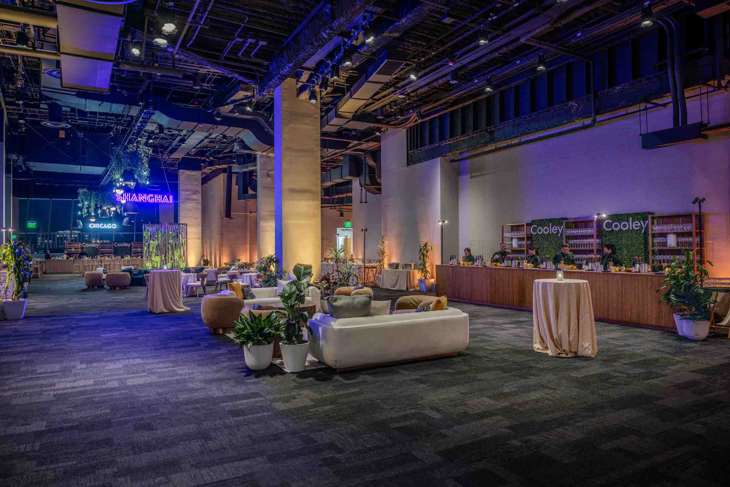 Rooftop reception with lounge seating and city views