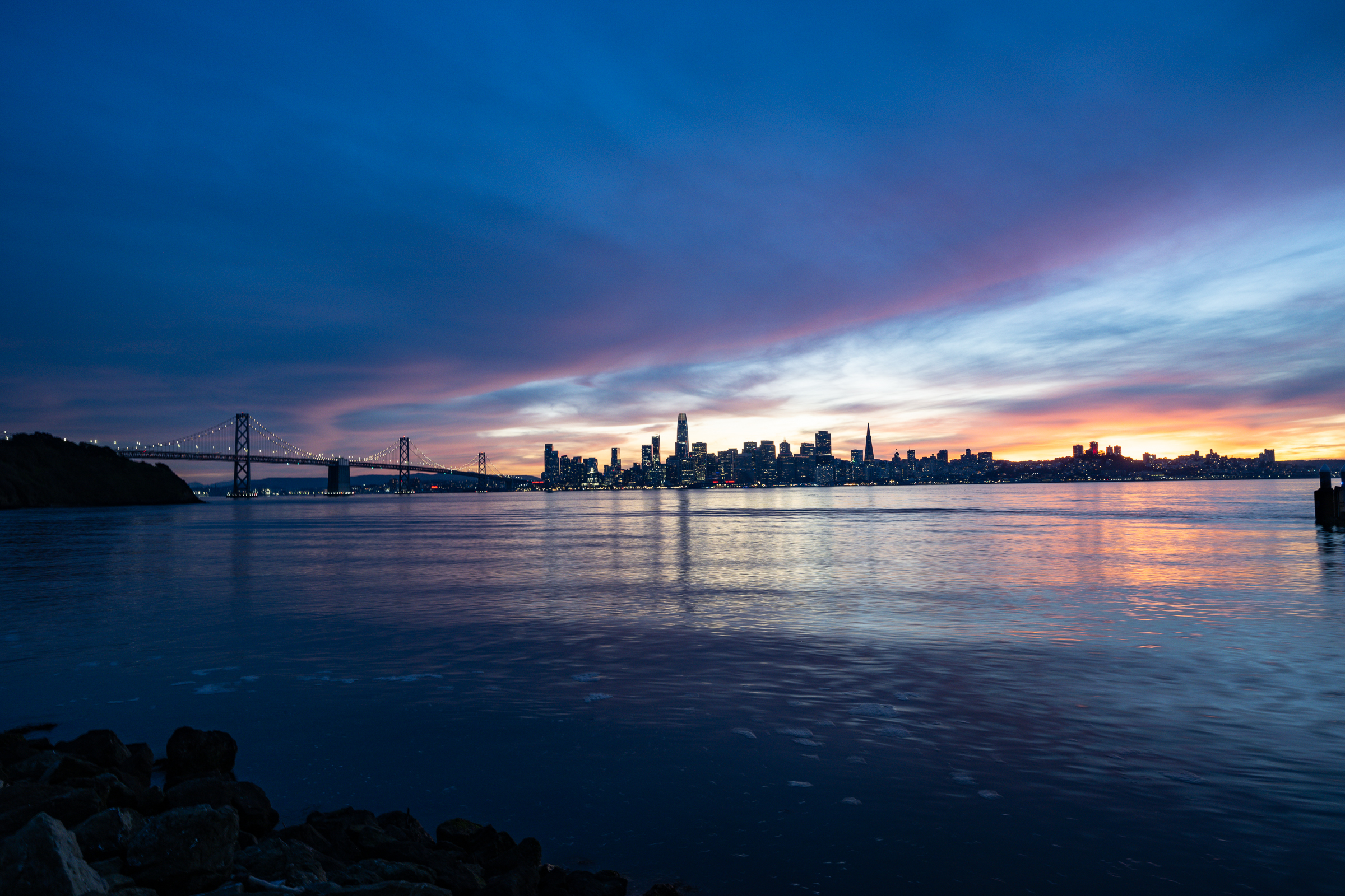 City skyline at sunset behind an evening reception venue