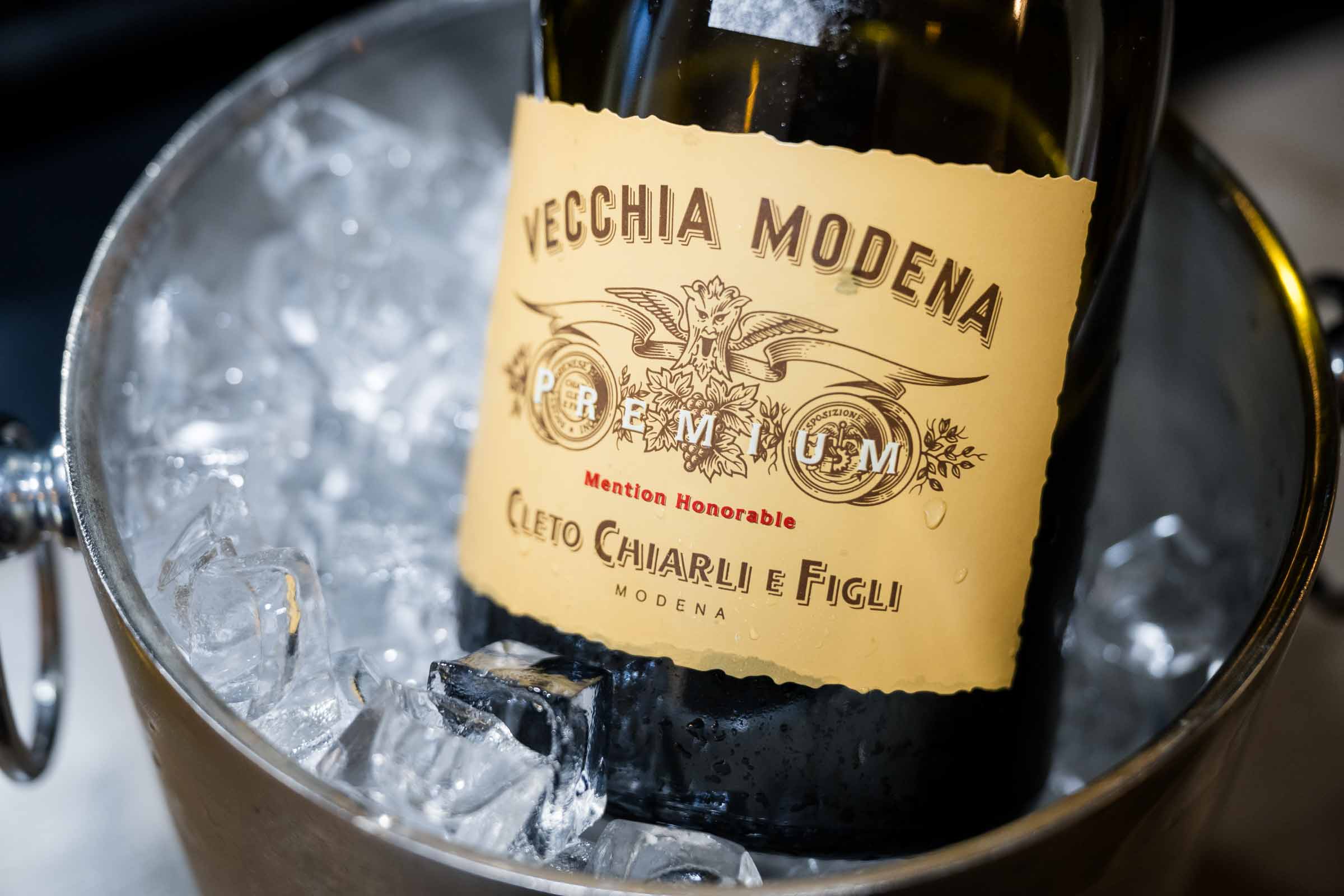 Wine bottle chilling in elegant ice bucket at event