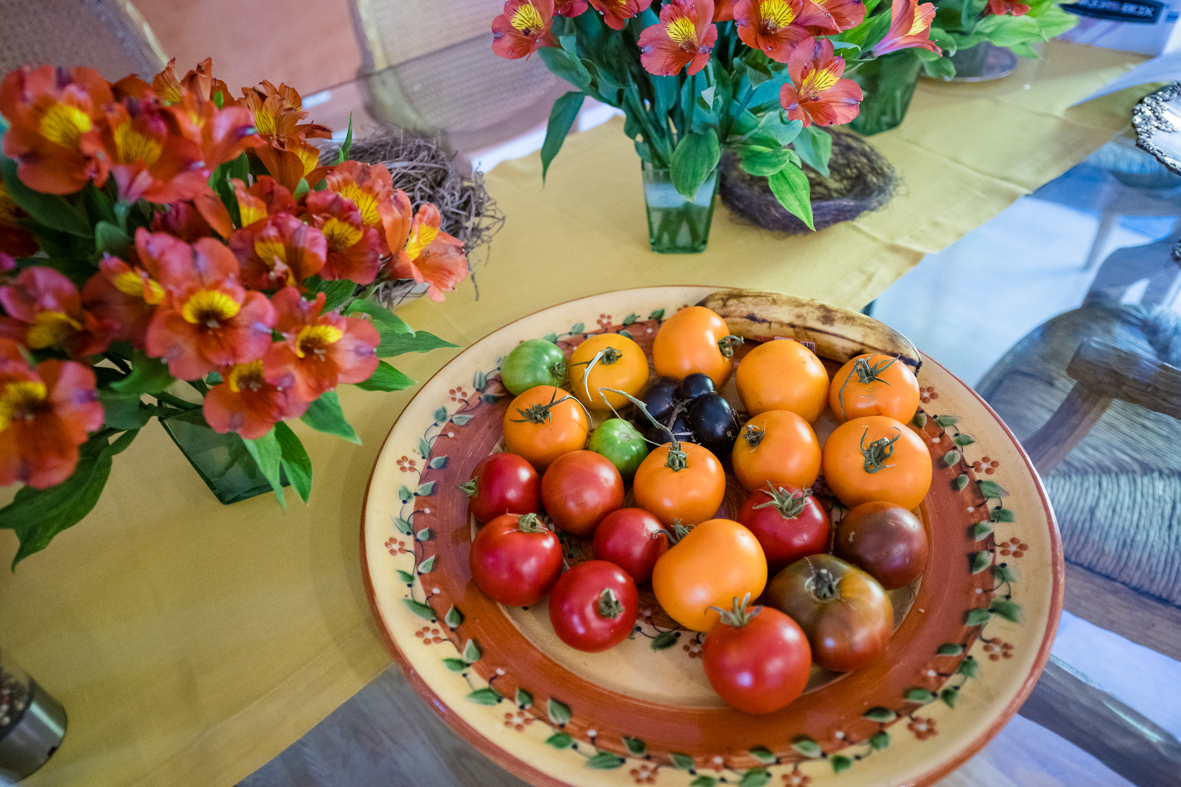 Table centerpiece with flowers and fruit at a formal evening event