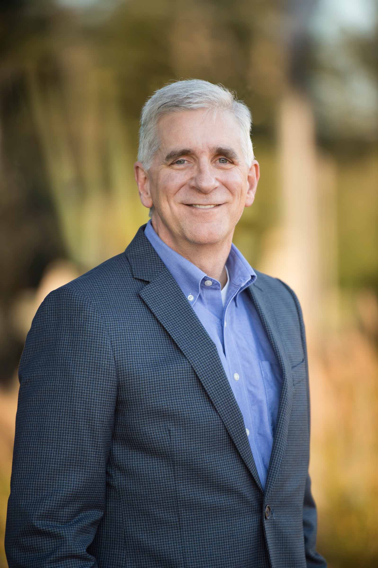 Executive portrait captured in outdoor setting