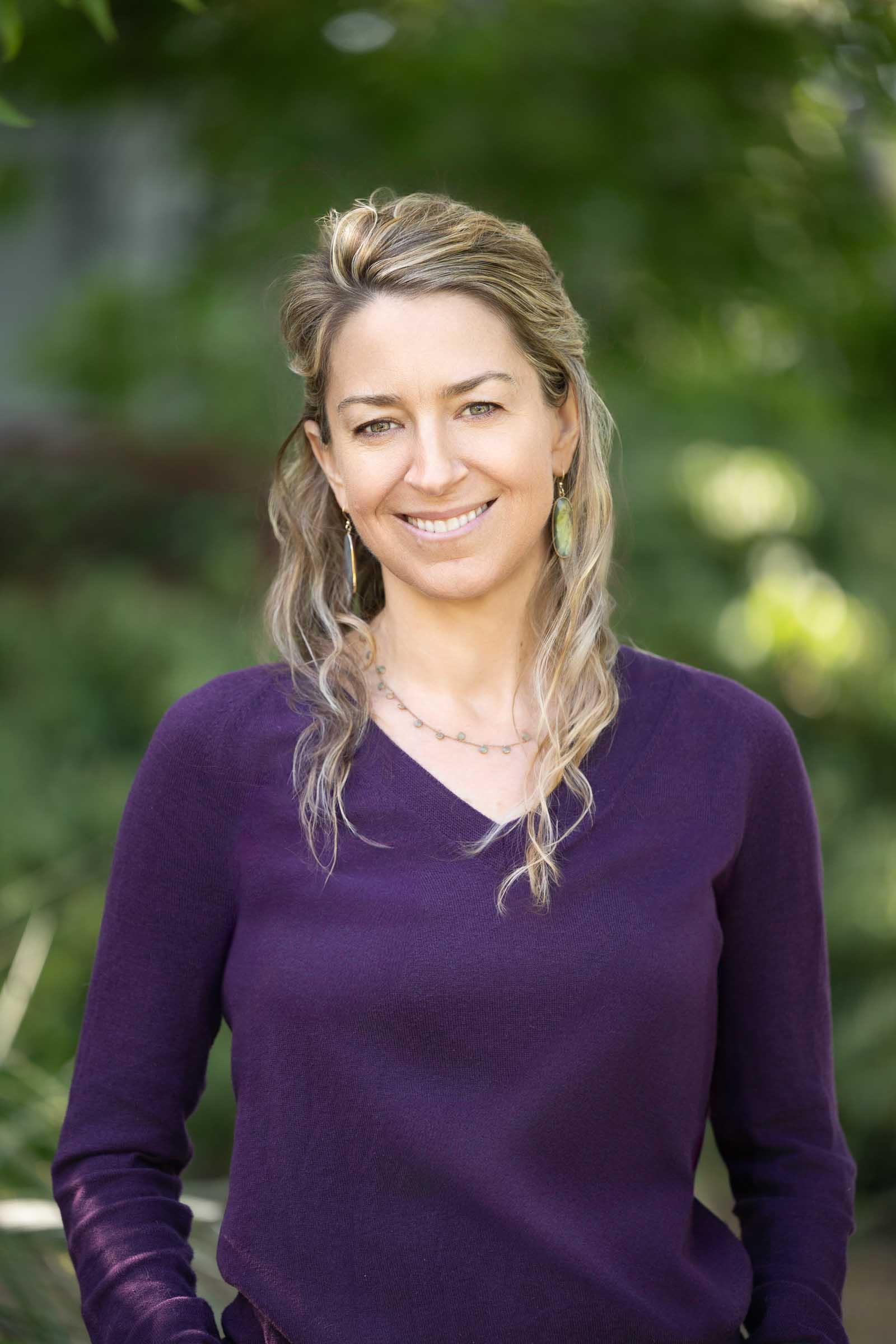 Professional portrait in lush garden setting
